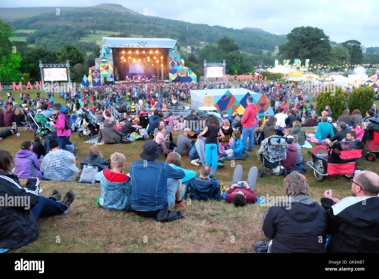 Green Man Festival, Wales, UK August  2016.   As evening falls fans watch the live music on the Mountain Stage - Over 25,000 music fans are due to attend over the weekend. Stock Photo