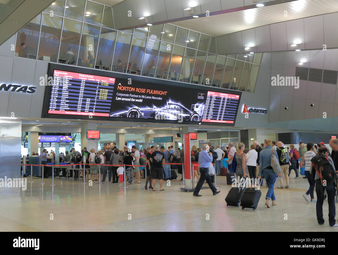 People queue at Melbourne Airport departure gate in Melbourne Australia. Stock Photo