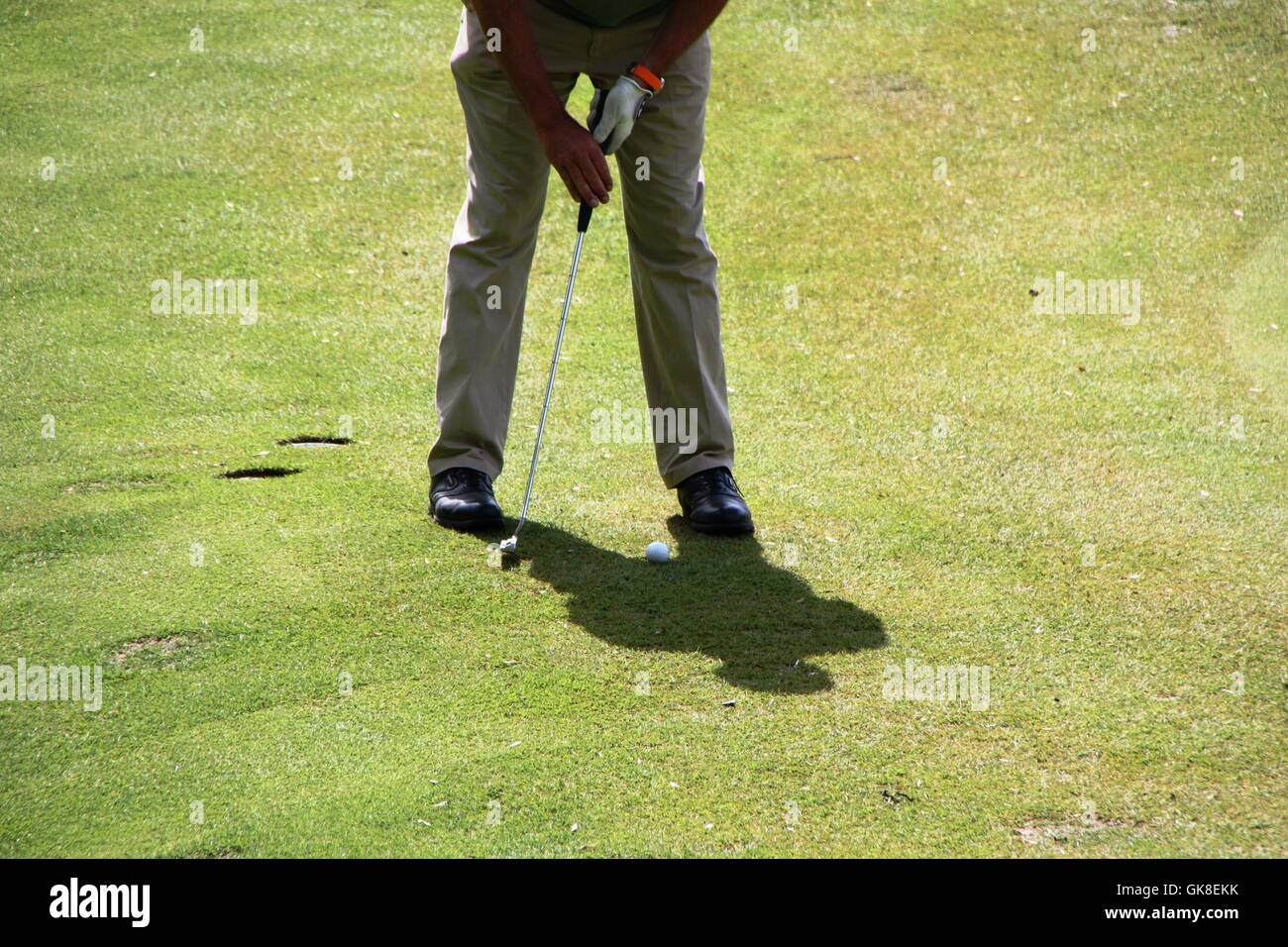 A golfer trying to hit the ball Stock Photo Alamy