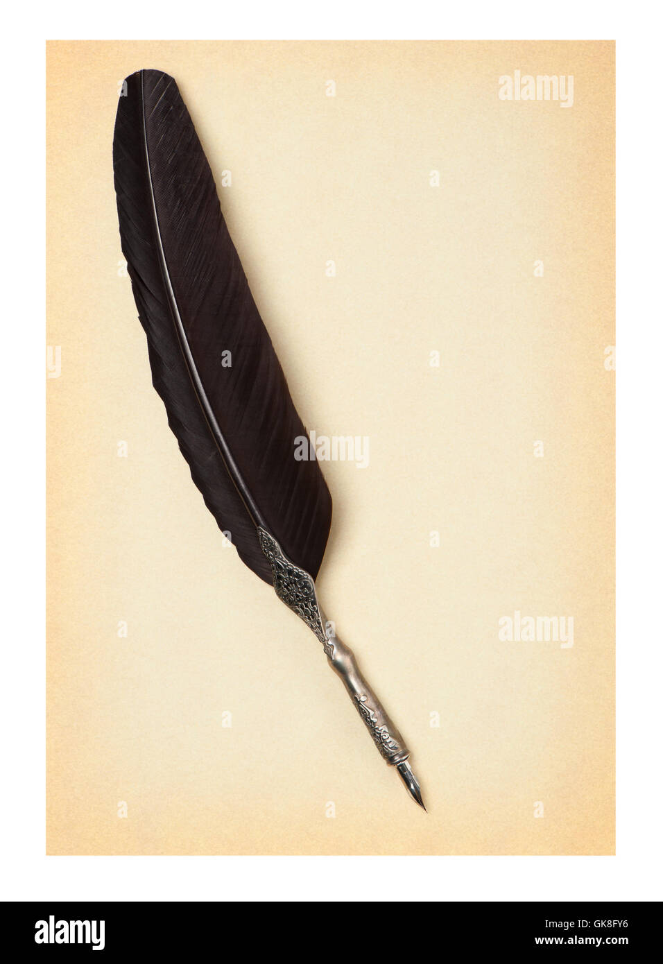Feather quill on an old paper Stock Photo - Alamy