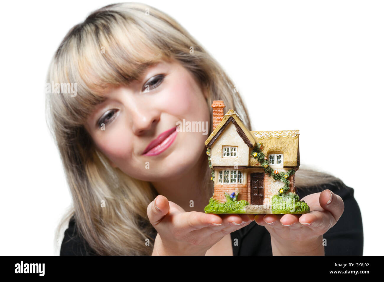 The business woman holds the small house in the hands Stock Photo - Alamy