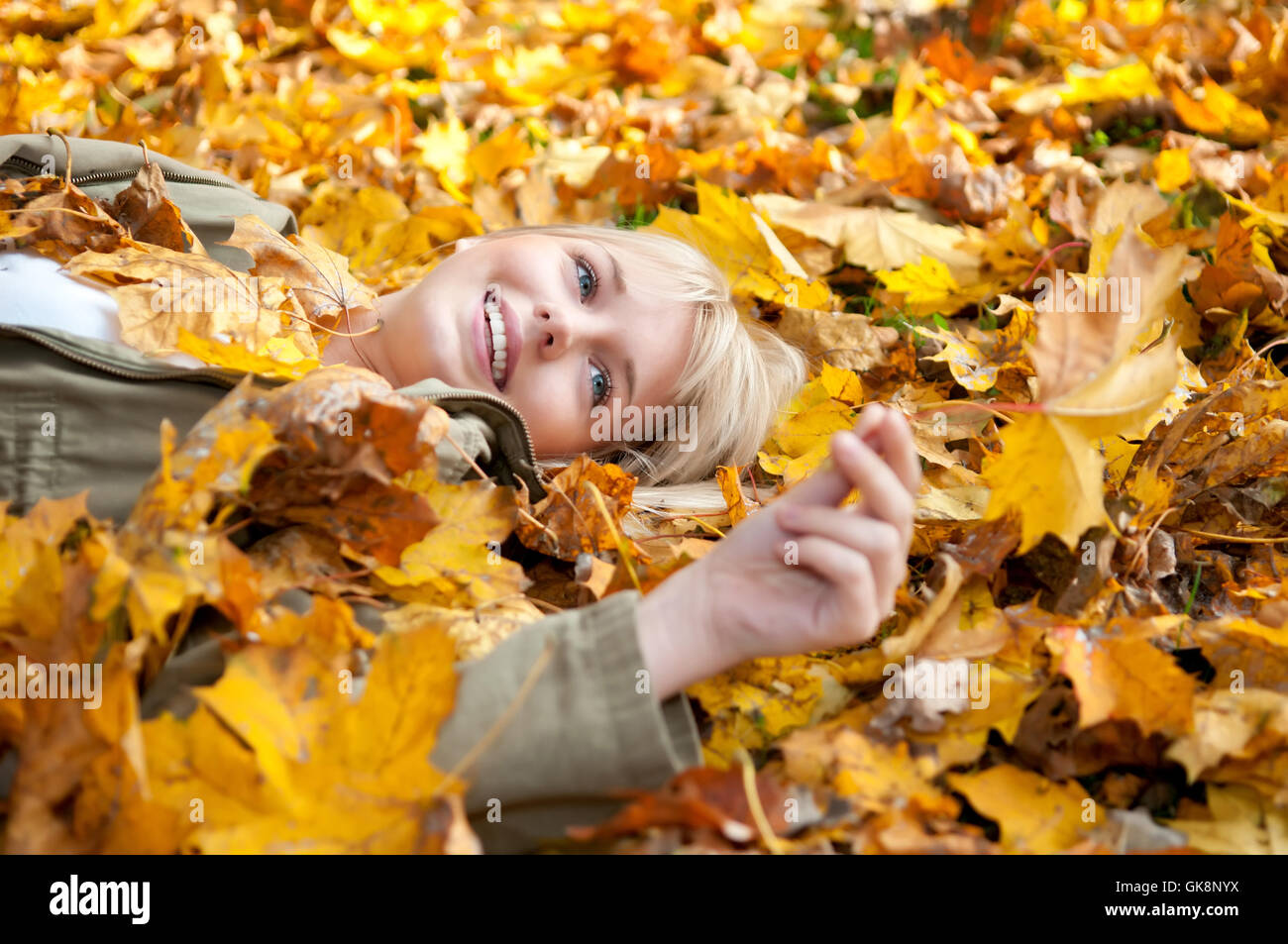 woman leaves lie Stock Photo