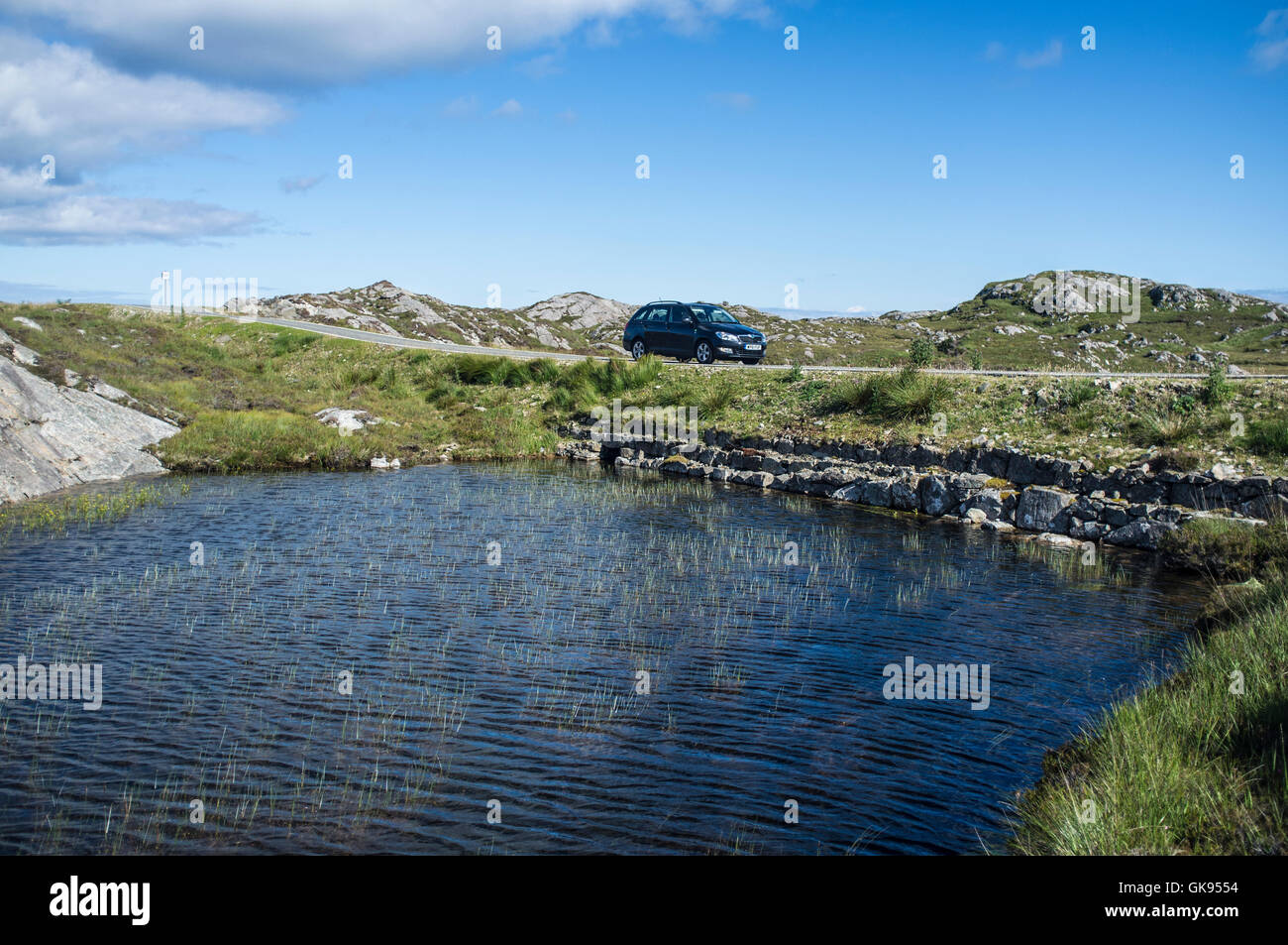A car on the Golden Road, The Bays, Harris, Outer hebrides Stock Photo