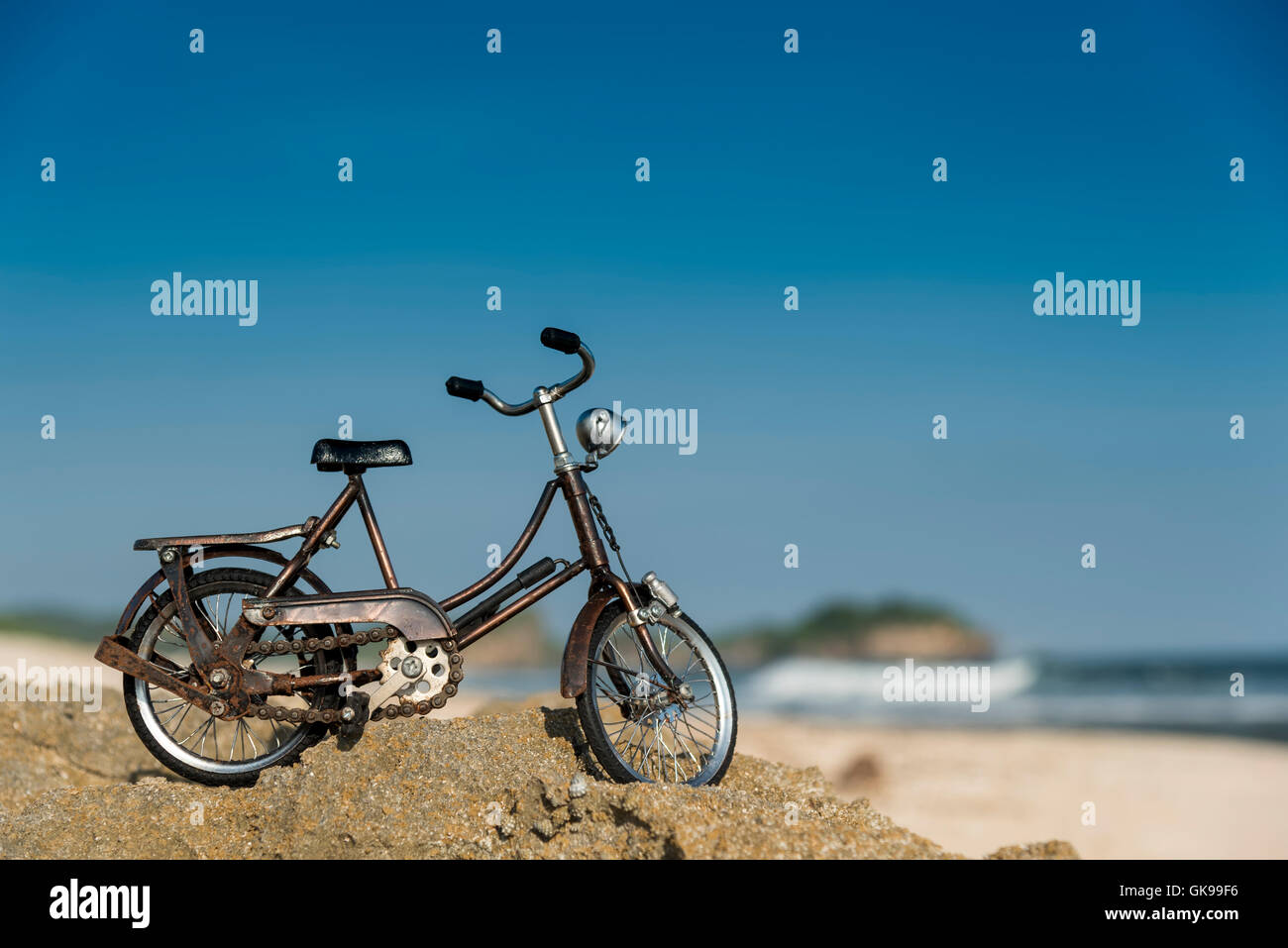 Small model bicycle on the beach Stock Photo