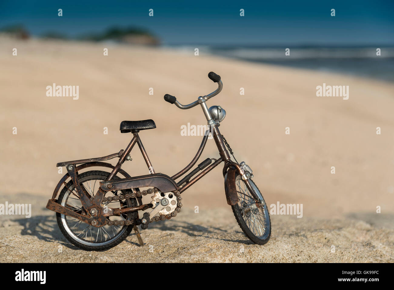 Small model bicycle on the beach Stock Photo