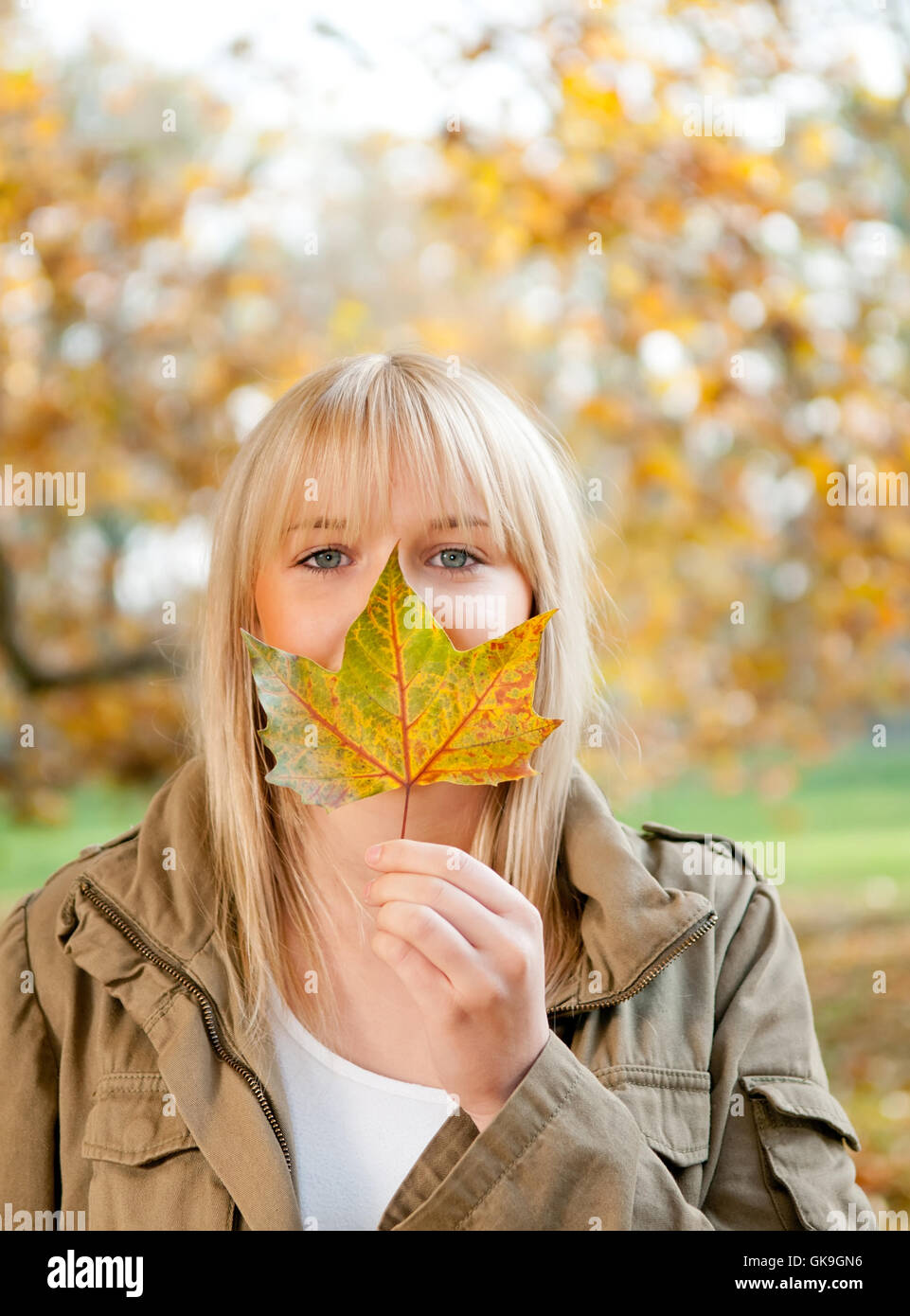young woman with autumn leaf Stock Photo