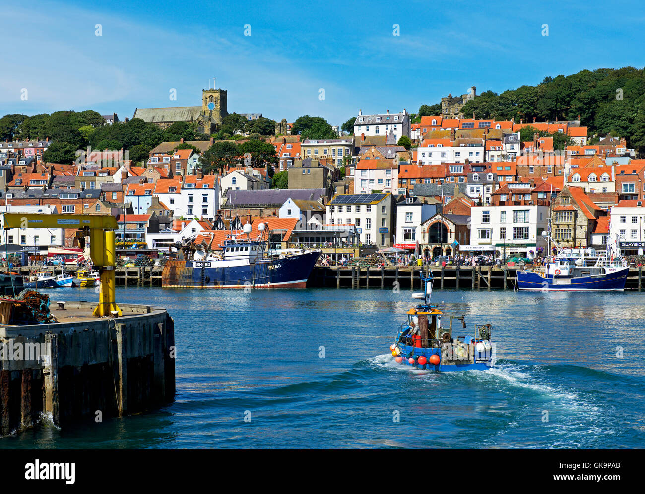 Fishing boat returning to the harbour, Scarborough, North Yorkshire, England UK Stock Photo