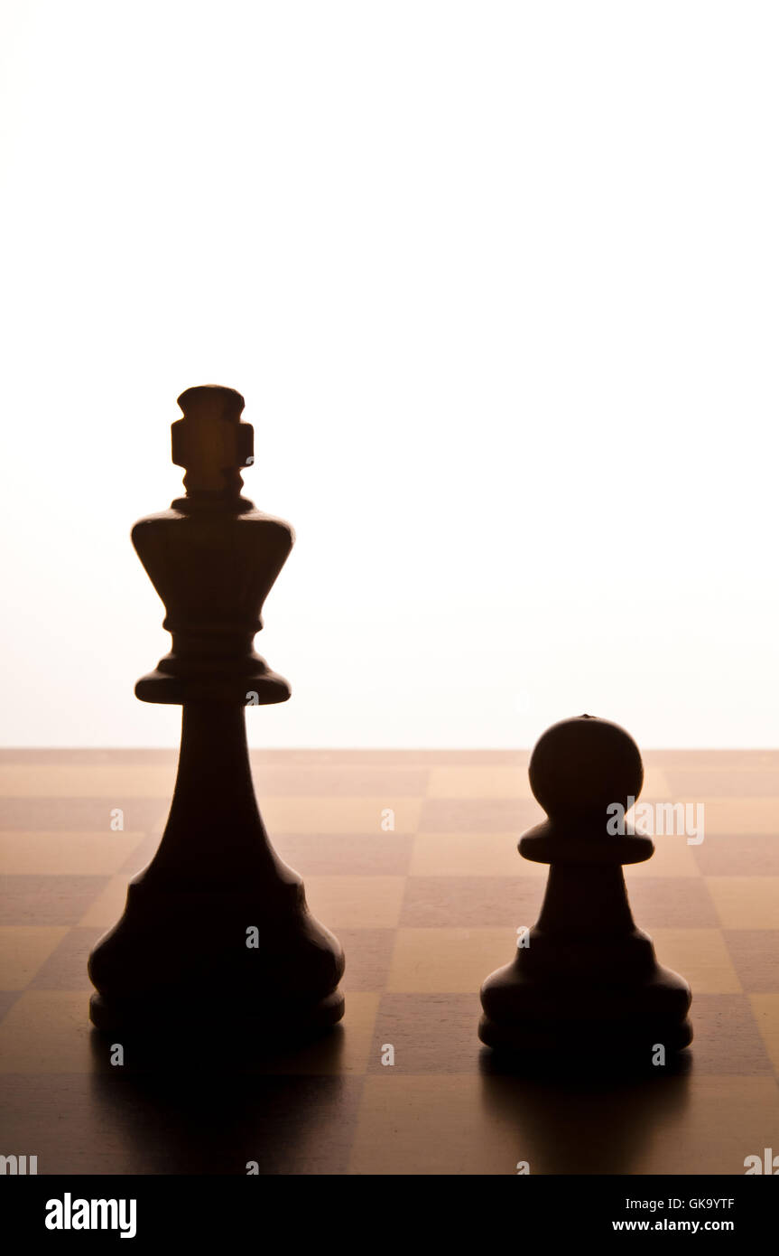 chess King and Pawn on the chessboard Stock Photo