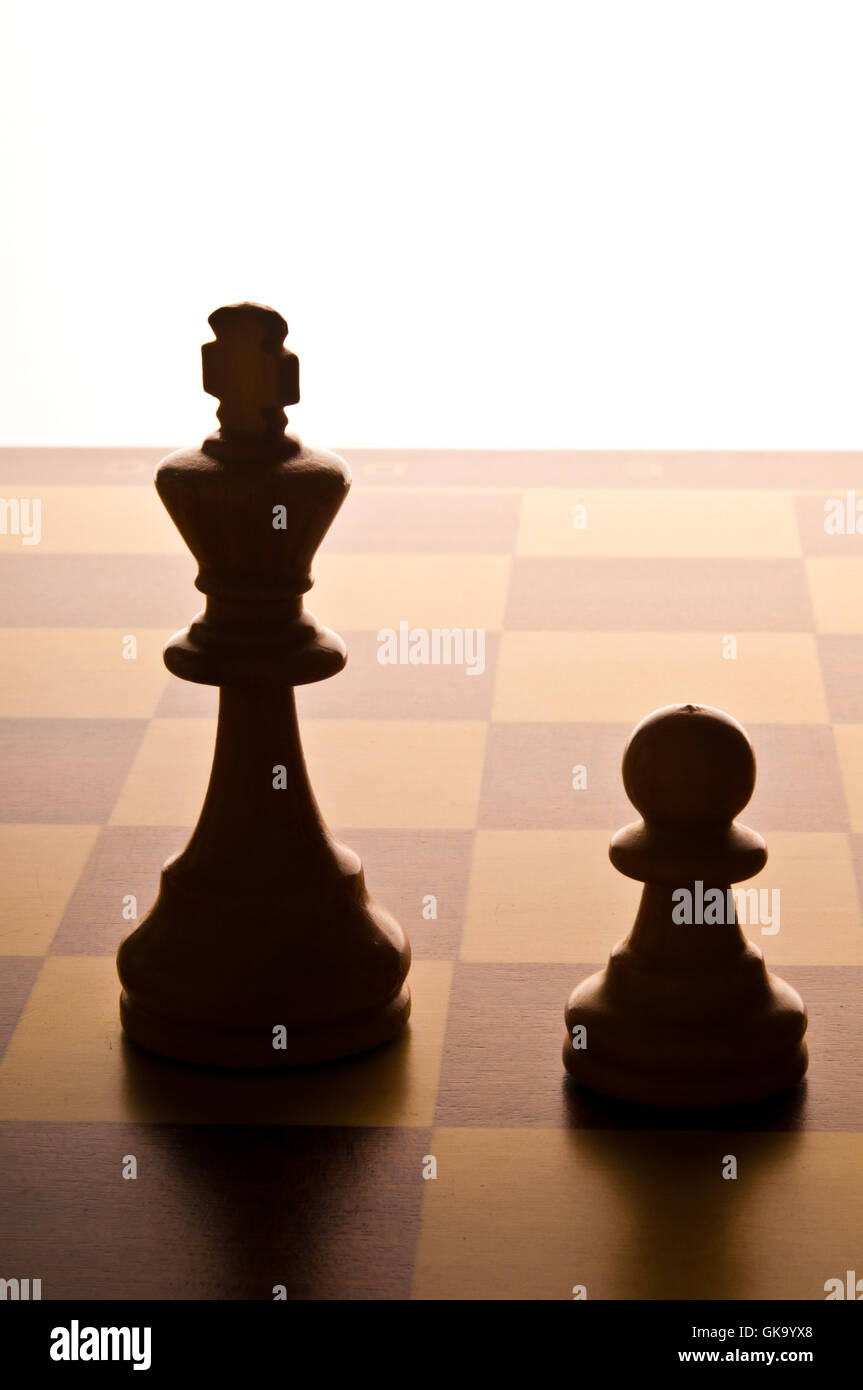 chess King and Pawn on the chessboard Stock Photo