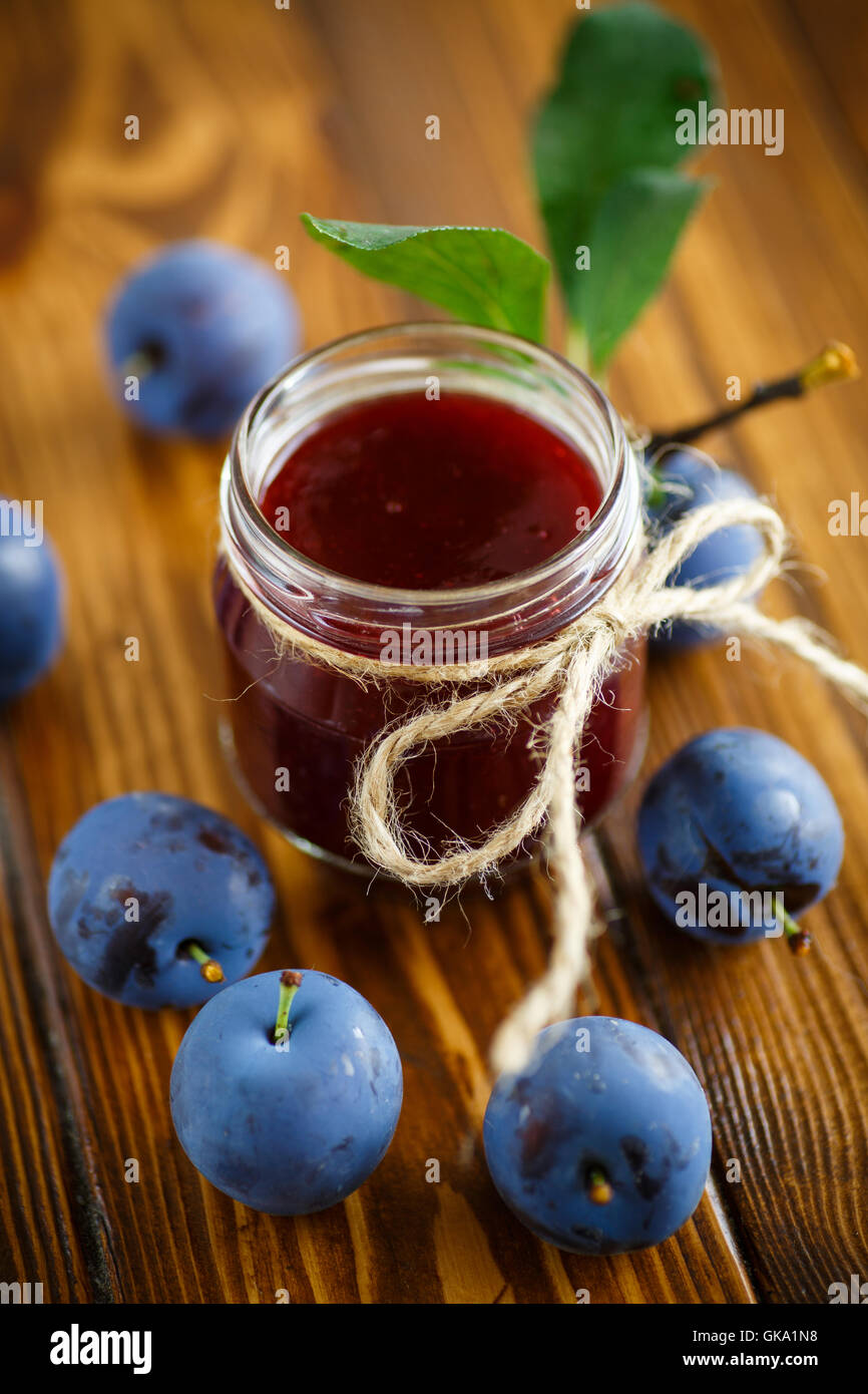 plum jam in a glass jar Stock Photo Alamy