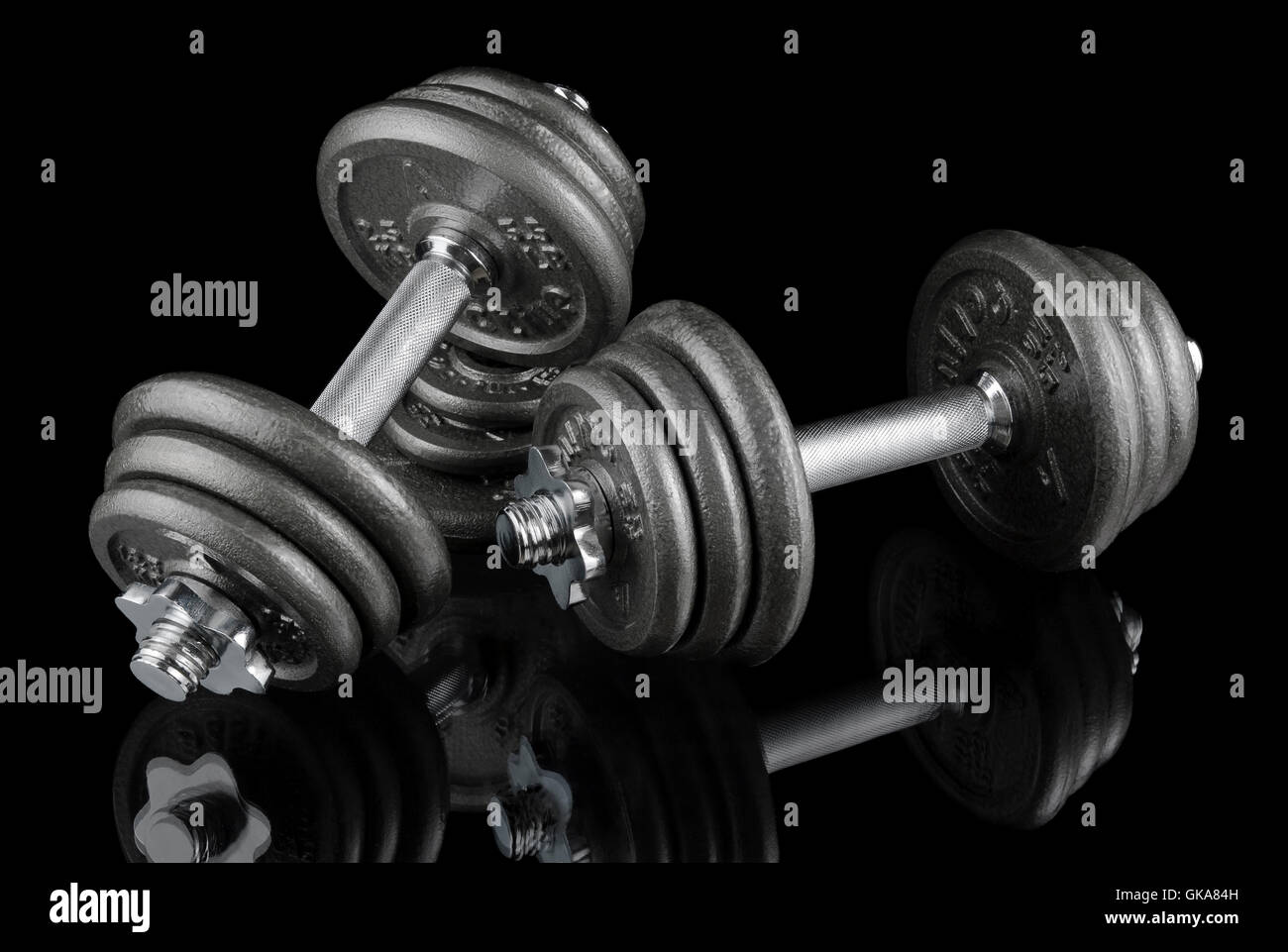 two dumbbells on black Stock Photo