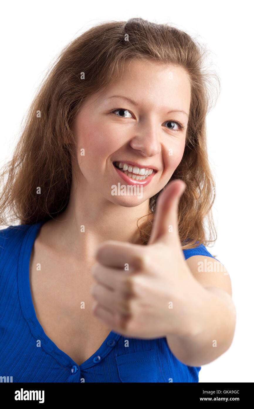 friendly smiling young woman with thumbs up Stock Photo