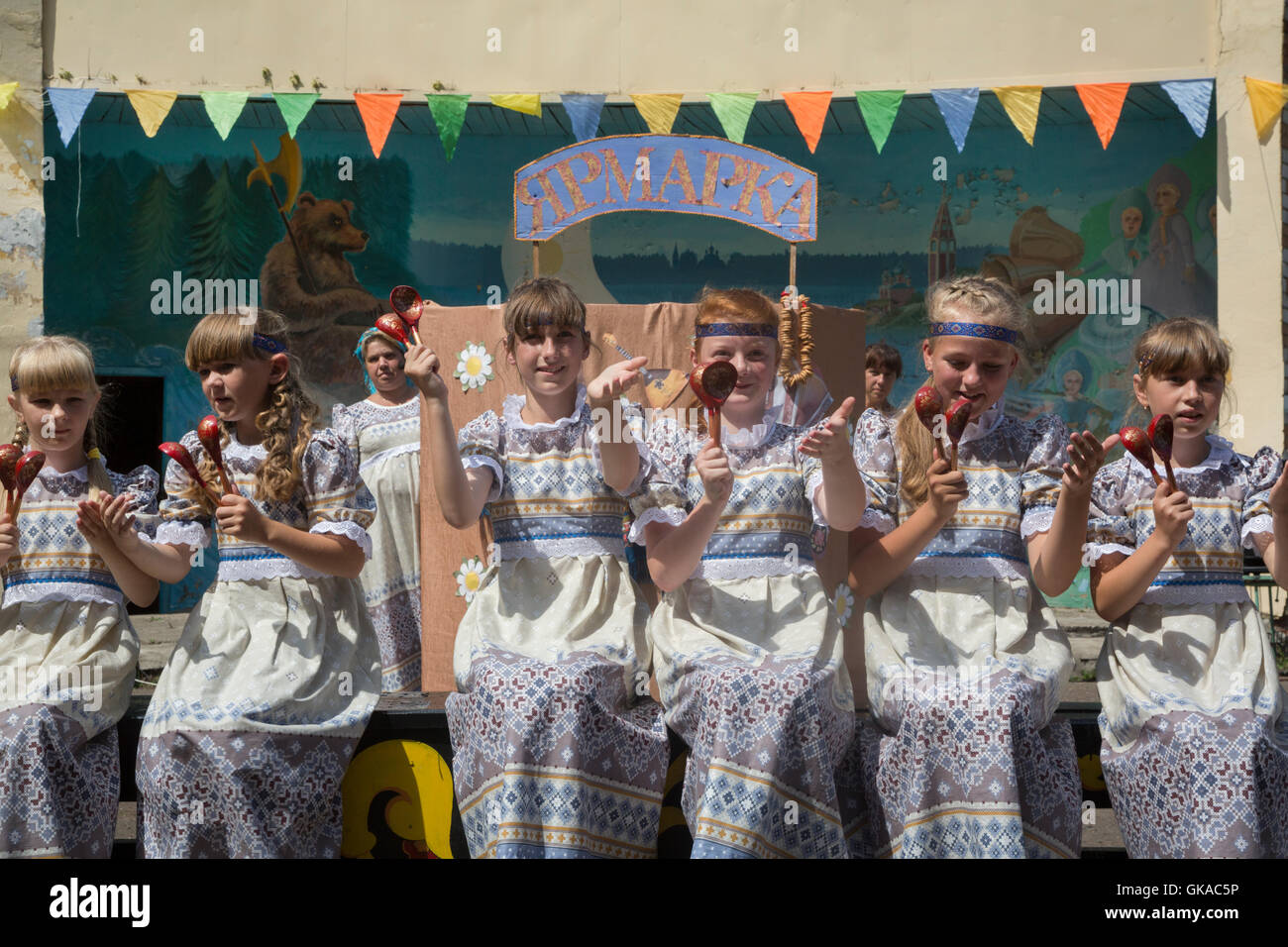 Girls playing on the Russian traditional musical instrument spoons