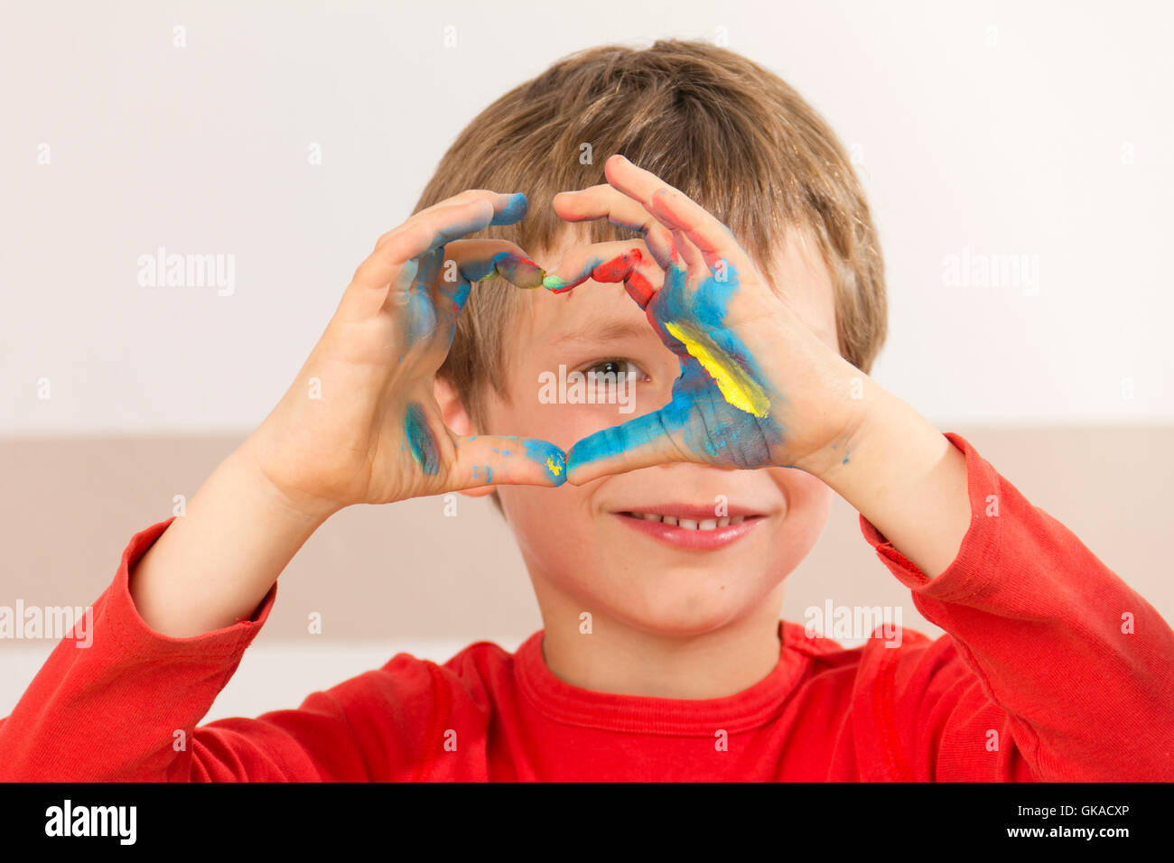 boy paints with finger paints Stock Photo Alamy
