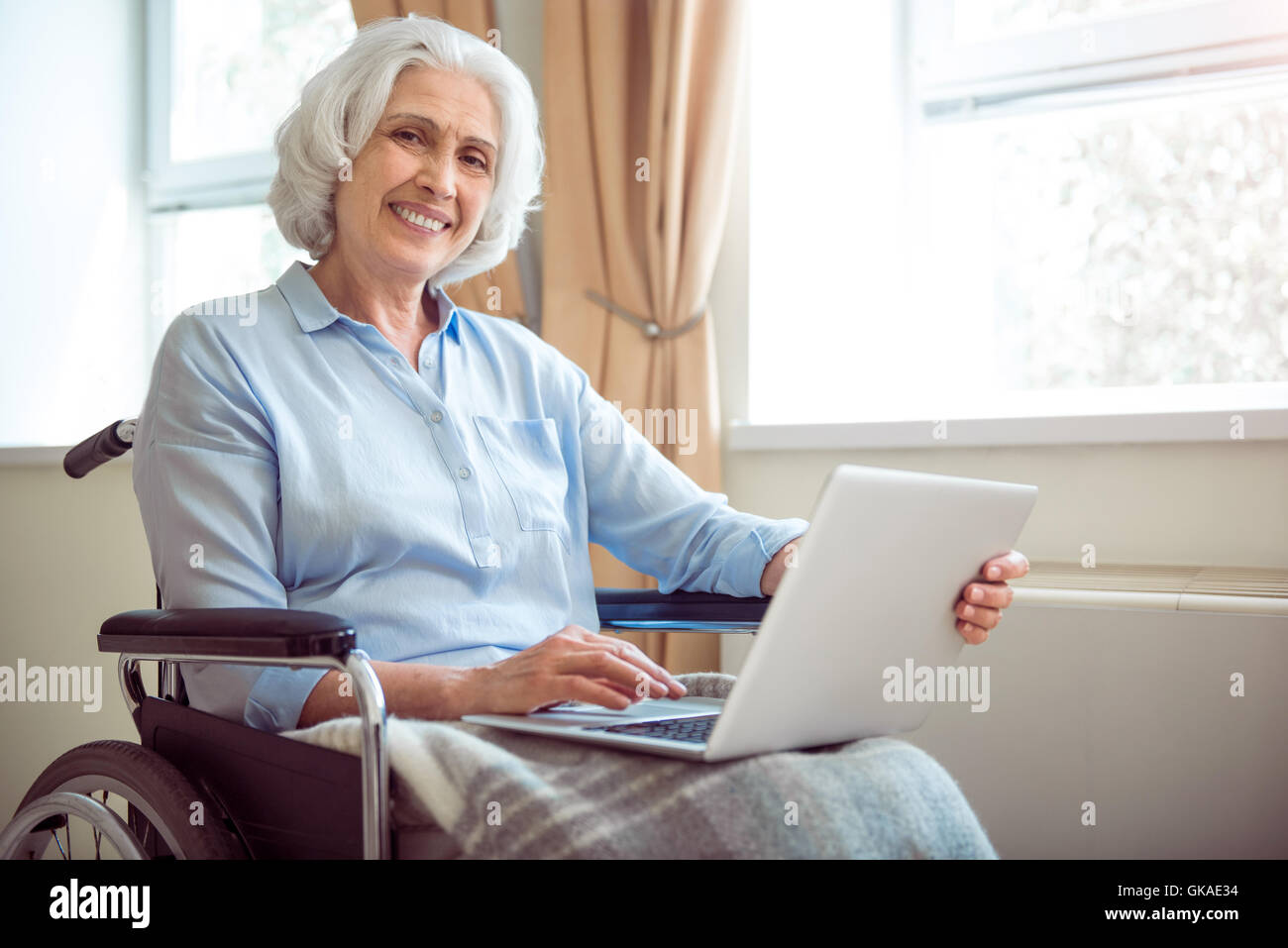 Disabled woman using computer Stock Photo Alamy