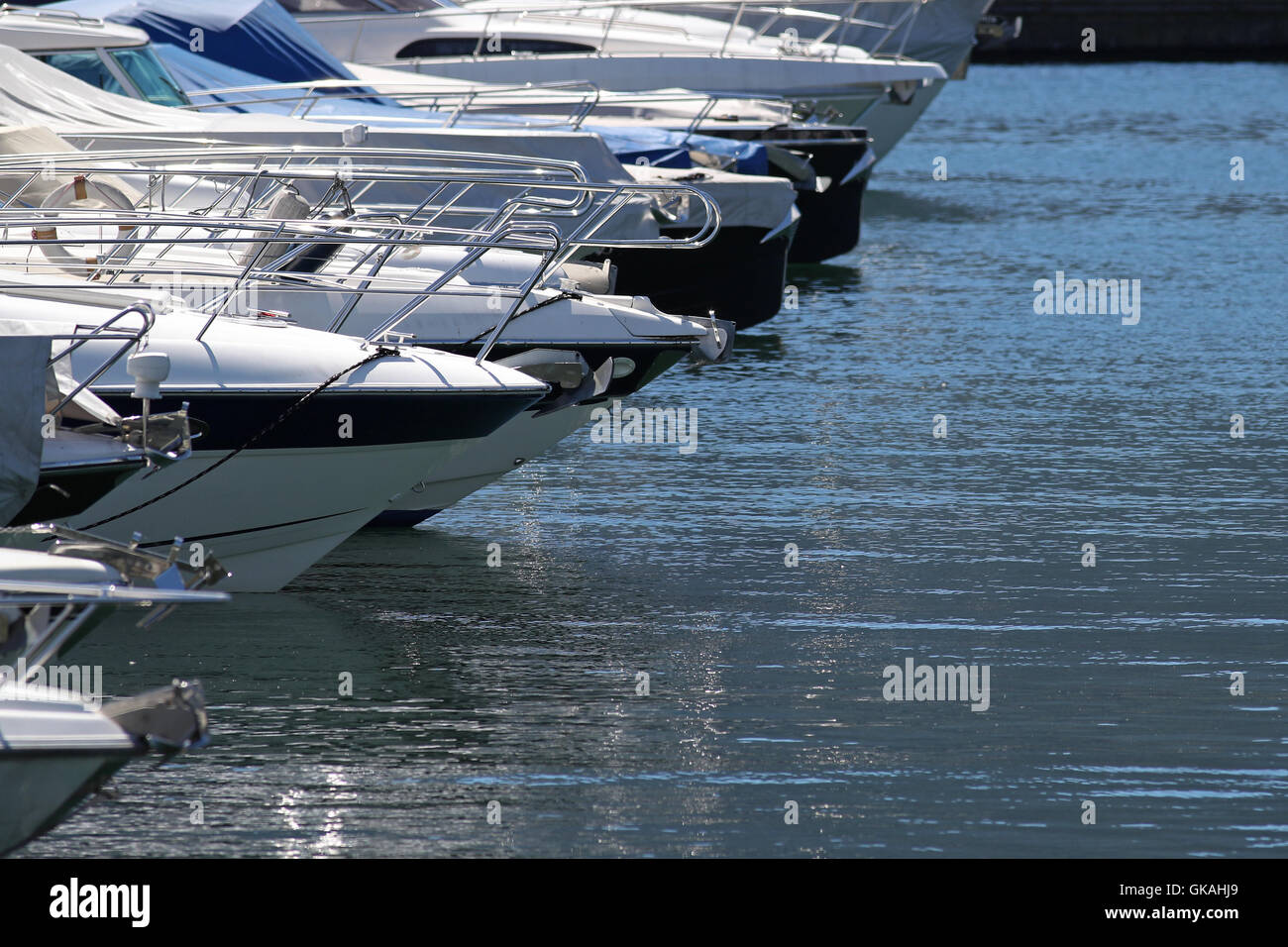 Line of expensive yachts docked at a marina Stock Photo