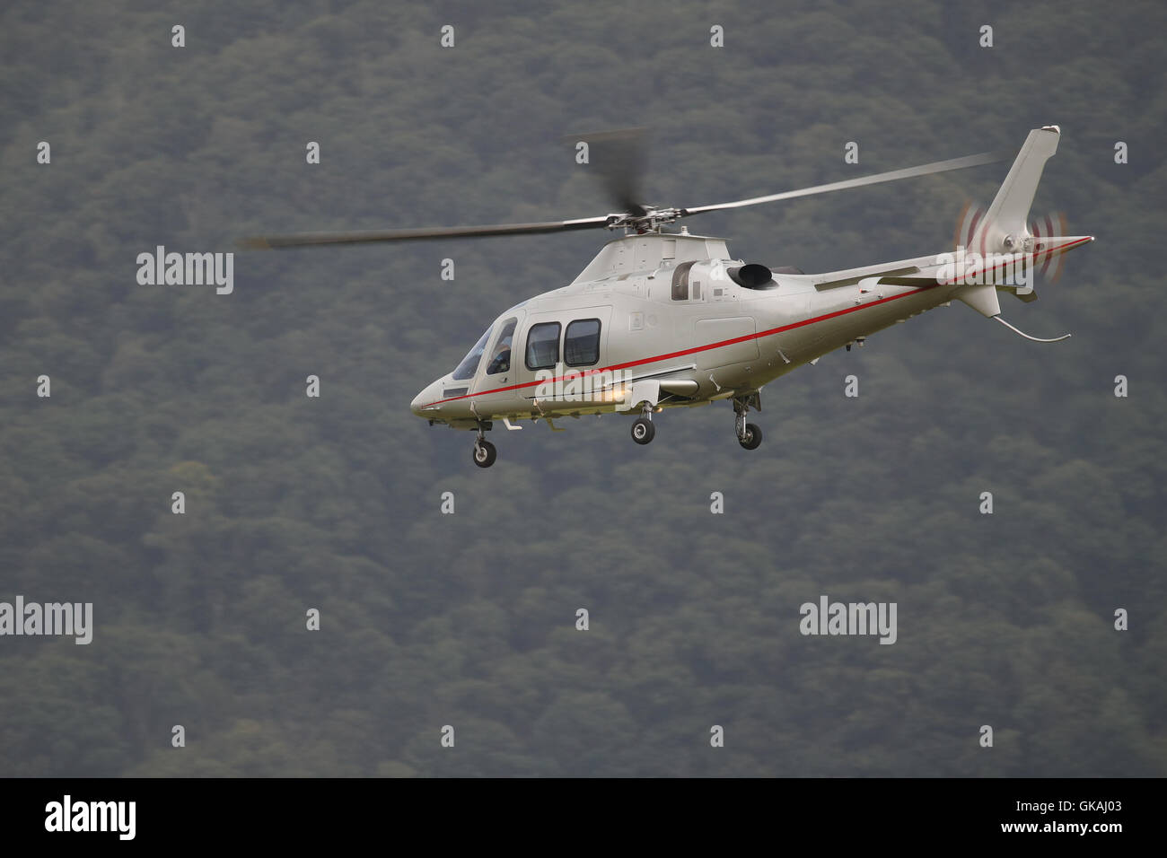 Business travel transport helicopter in flight Stock Photo
