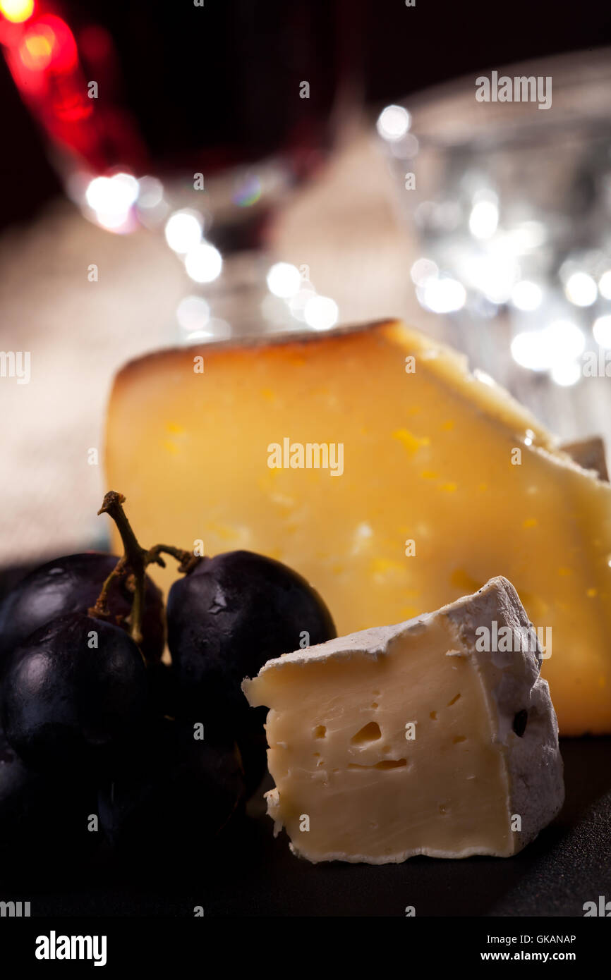 closeup of swiss cheese with grapes and wine Stock Photo Alamy