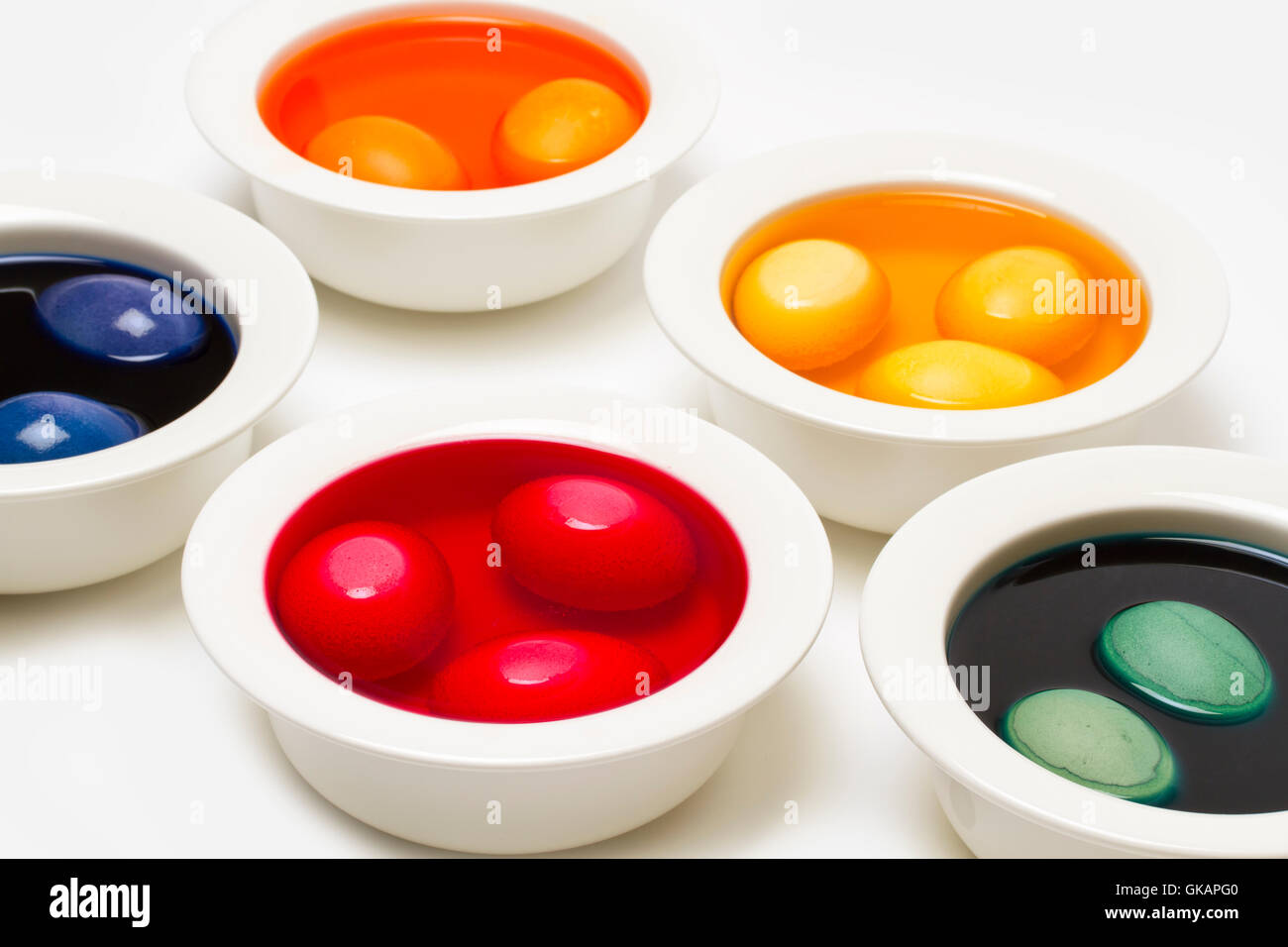 bowls with dyed easter eggs Stock Photo