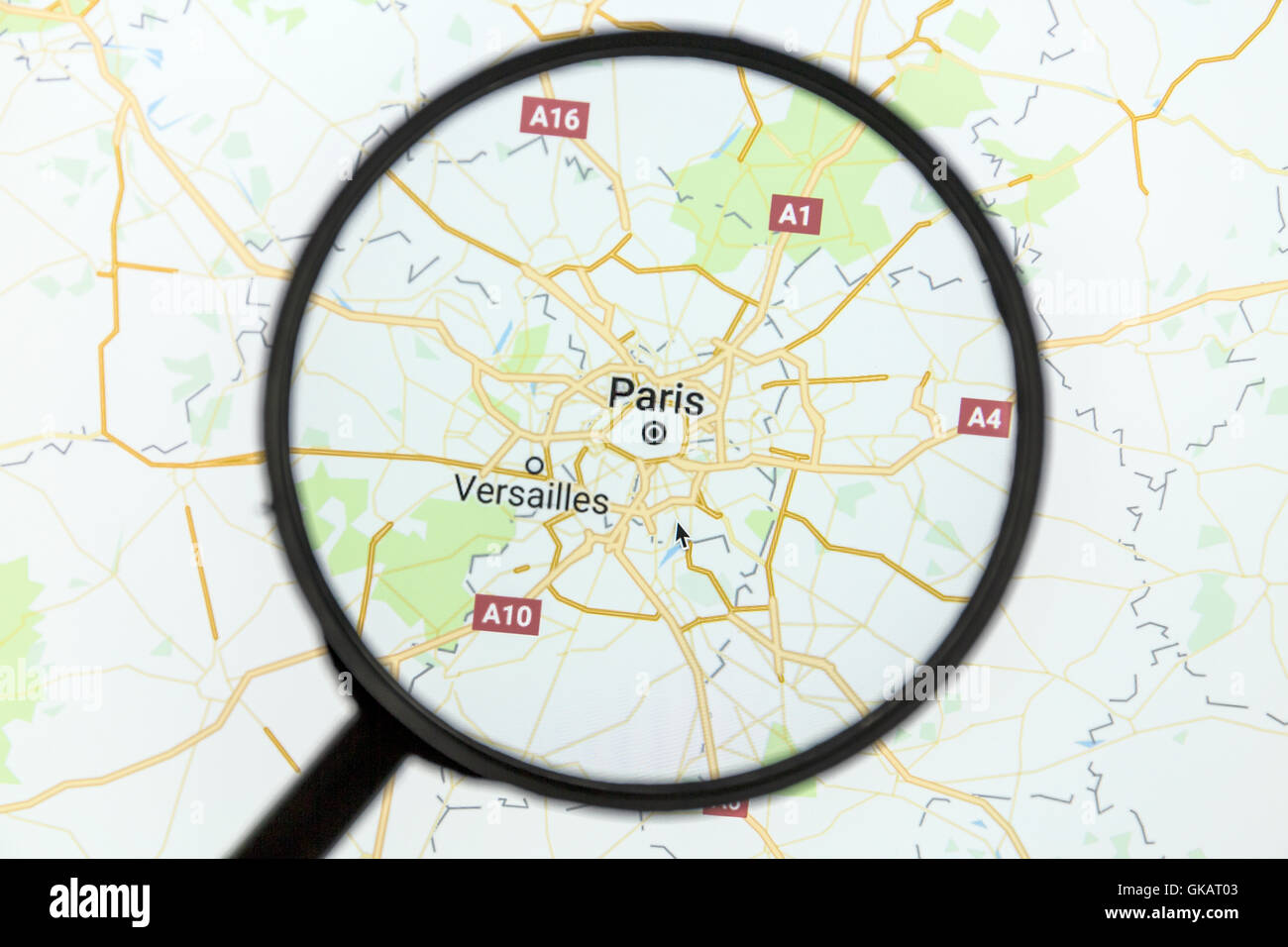 Map of Paris on Google Maps under a magnifying glass Stock Photo