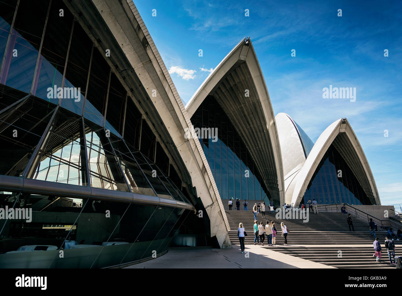 tourists visiting sydney opera house landmark detail in australia on sunny day Stock Photo