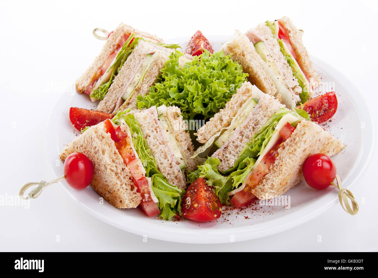 fresh club sandwich with ham,cheese,bacon and salad isoli Stock Photo