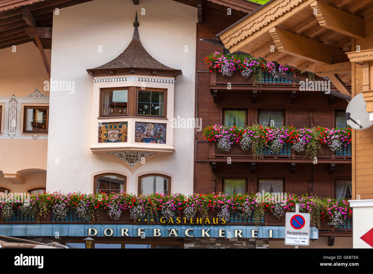 Traditional Austrian Houses With Flowers In Windows In Tux