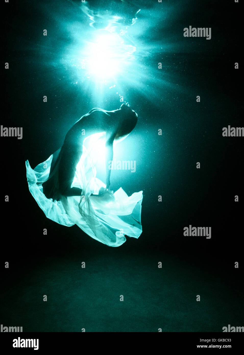 Silouette of a woman in a pool at night, Virginia Beach, Virginia Stock Photo