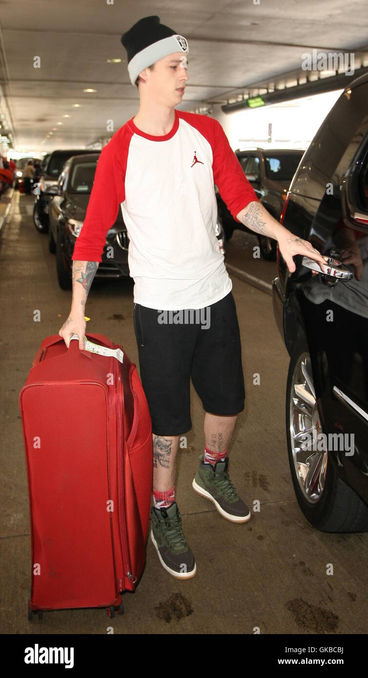 Ash Stymest loads Lily Rose Depp's luggage as she arrives at LAX  Featuring: Ash Stymest Where: Los Angeles, California, United States When: 15 May 2016 Stock Photo