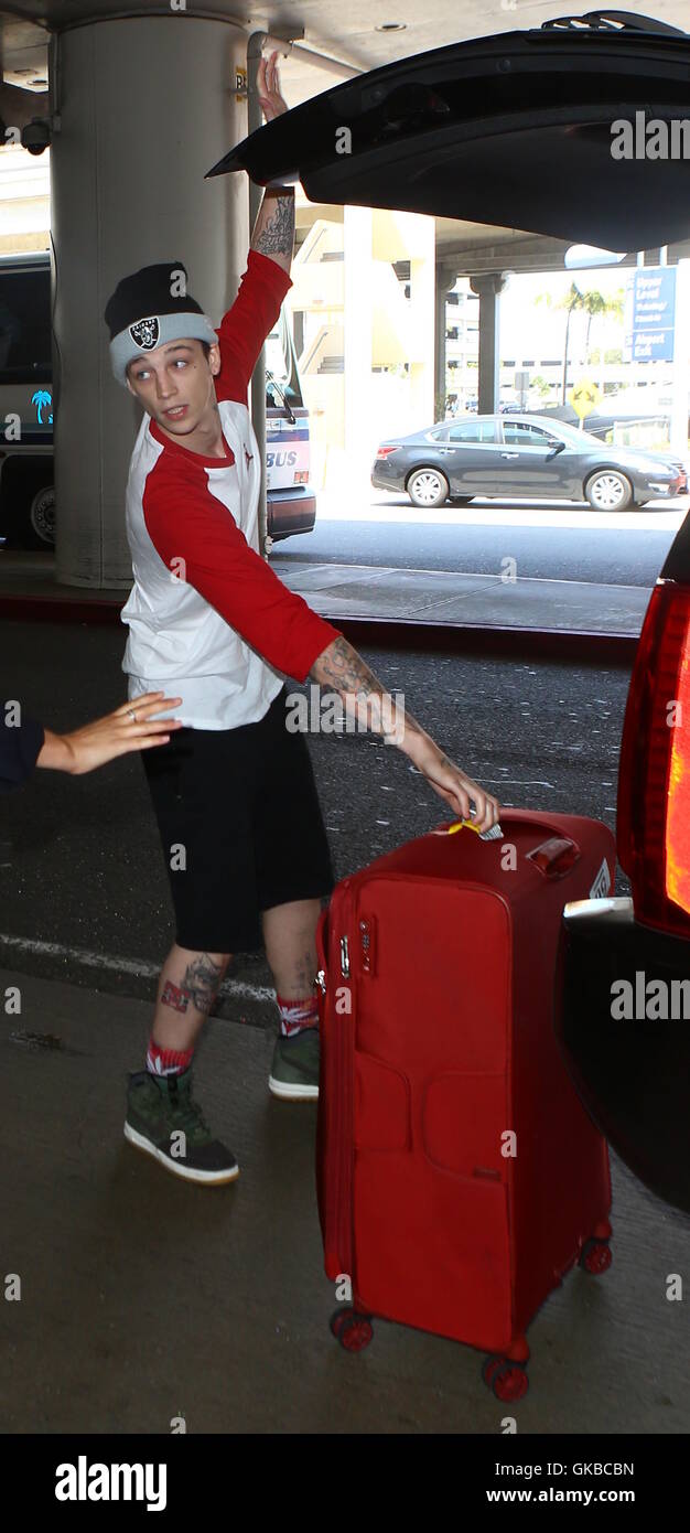 Ash Stymest loads Lily Rose Depp's luggage as she arrives at LAX  Featuring: Ash Stymest Where: Los Angeles, California, United States When: 15 May 2016 Stock Photo