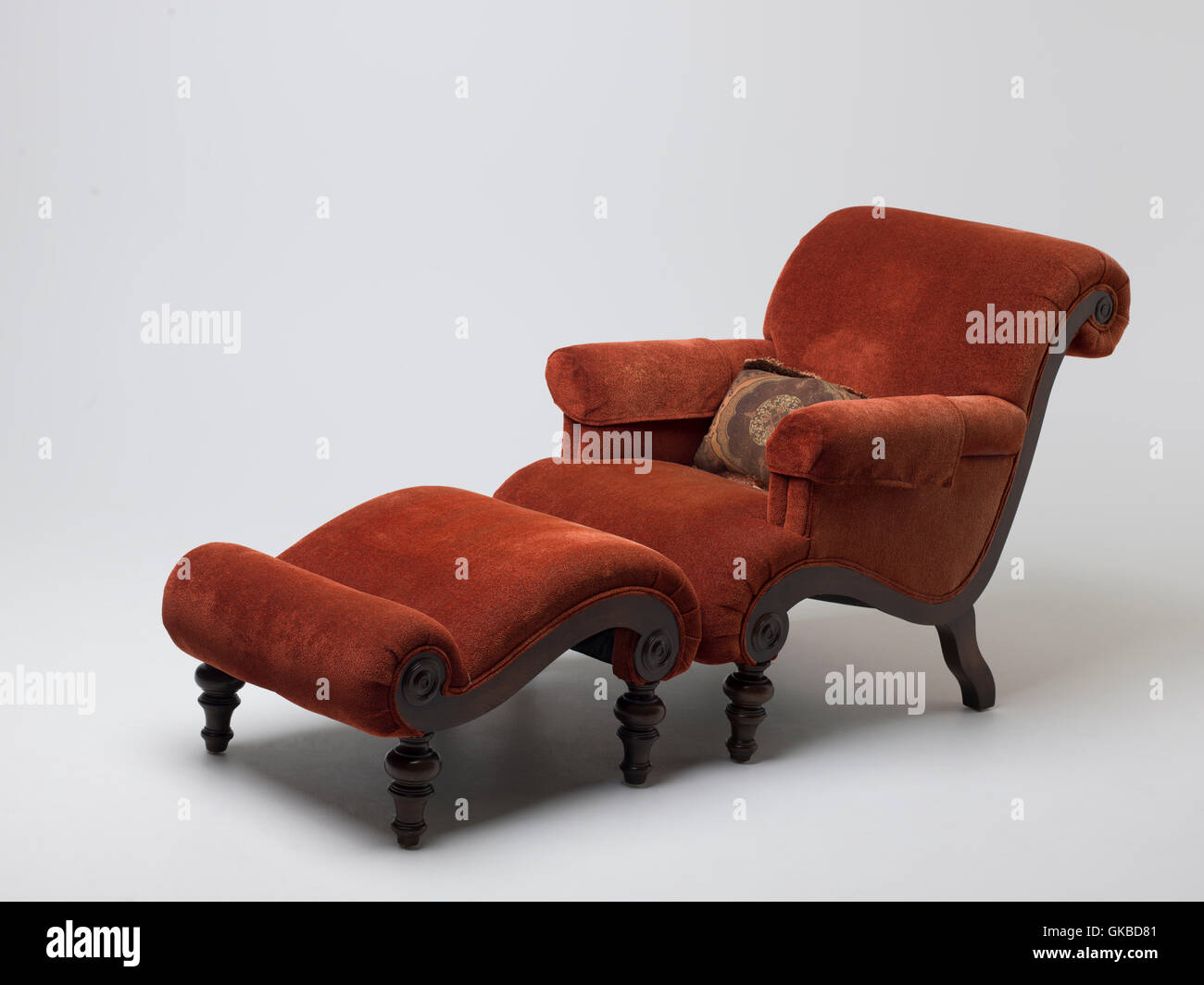 Burnt sienna chair and ottoman set Stock Photo