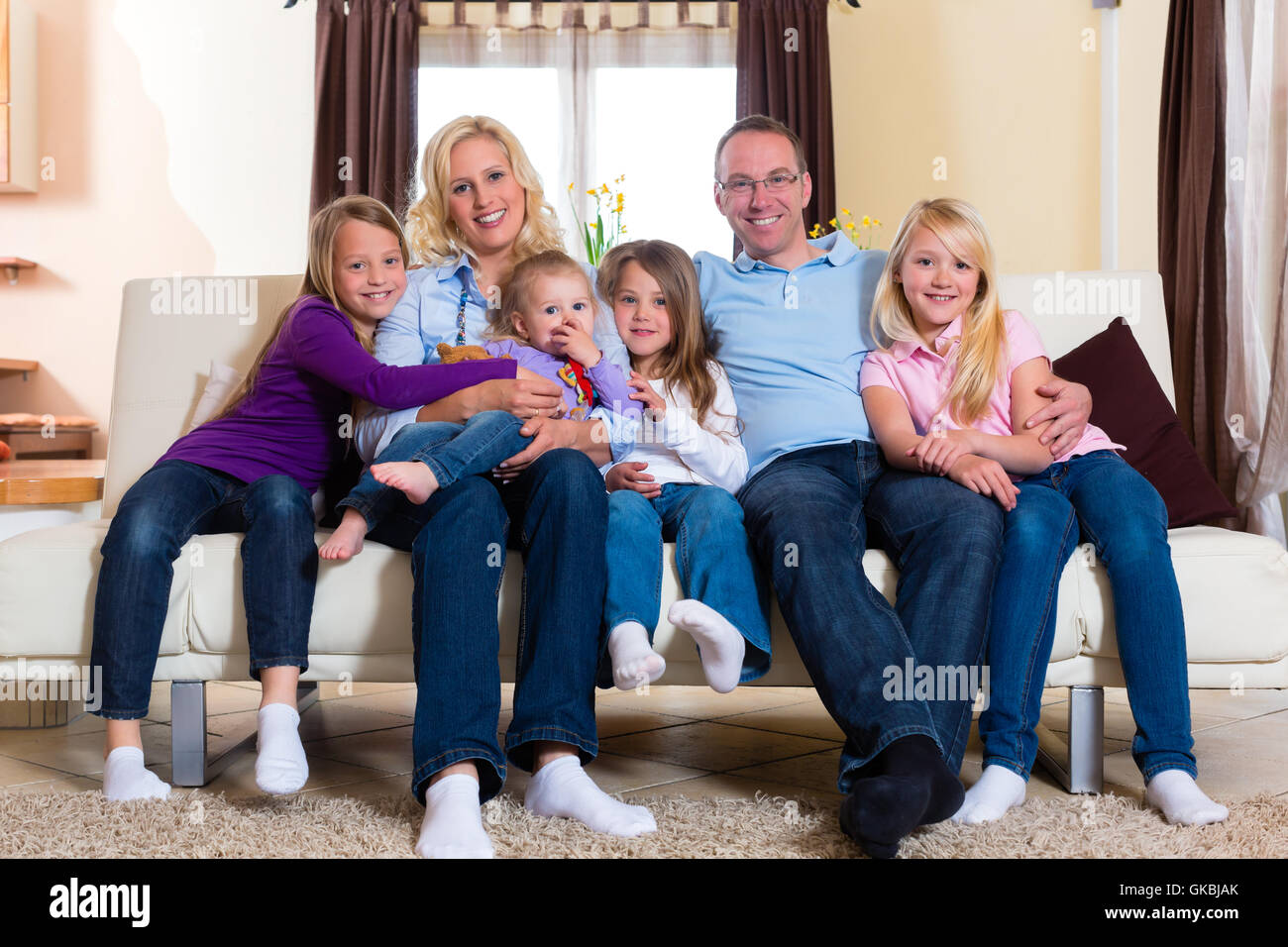 family on the couch Stock Photo Alamy