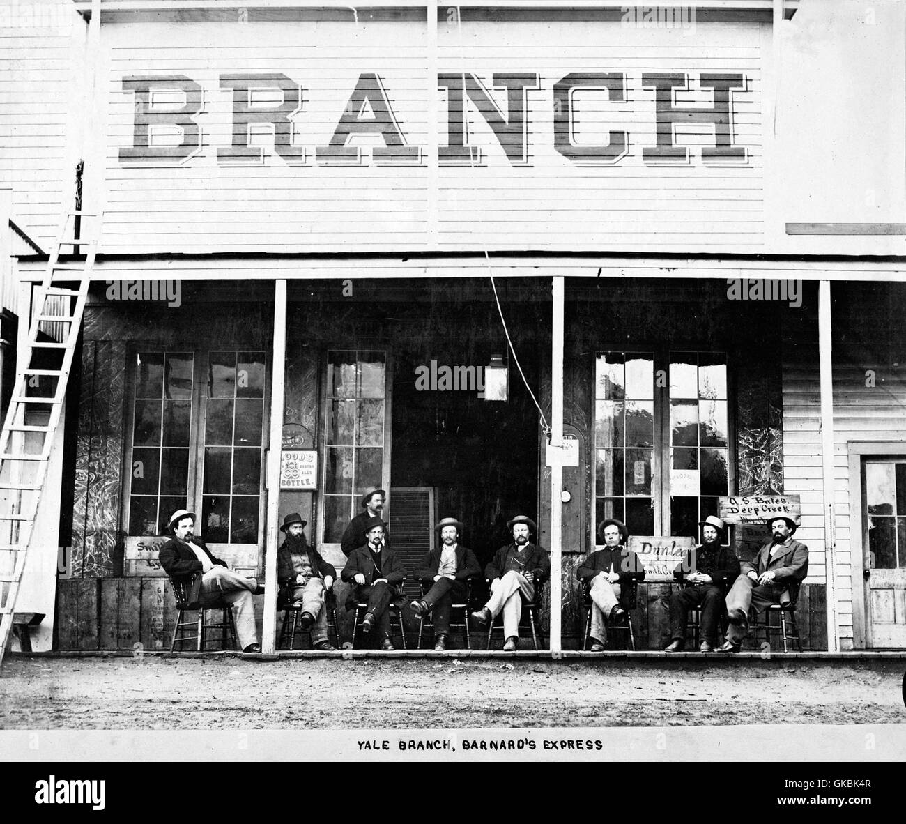 BARNARD'S EXPRESS. Employees at the  Candian stage coach company outside their Yale branch in British Columbia about 1867. Photo Frederick Dally/University of British Columbia  Creator: Dally, Frederick  Date Created: [1867 or 1868]  Source: Original Format: University of British Columbia. Library. Rare Books and Special Collections. Langmann Collection.  Permanent URL: http://digitalcollections.library.ubc.ca/cdm/ref/collection/langmann/id/309  Project Website:http://digitalcollections.library.ubc.ca/cdm/landingpage/collection/langmann Stock Photo