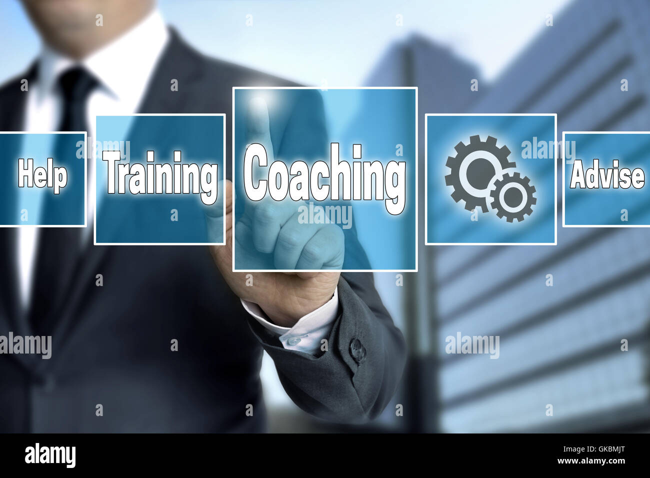 coaching touchscreen is operated by businessman. Stock Photo