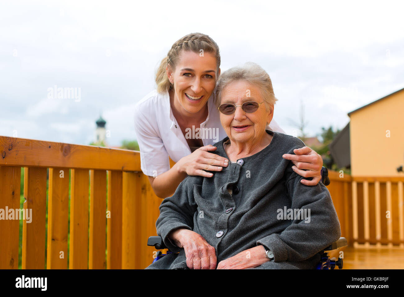 age and care - nurse and a senior in wheelchair Stock Photo