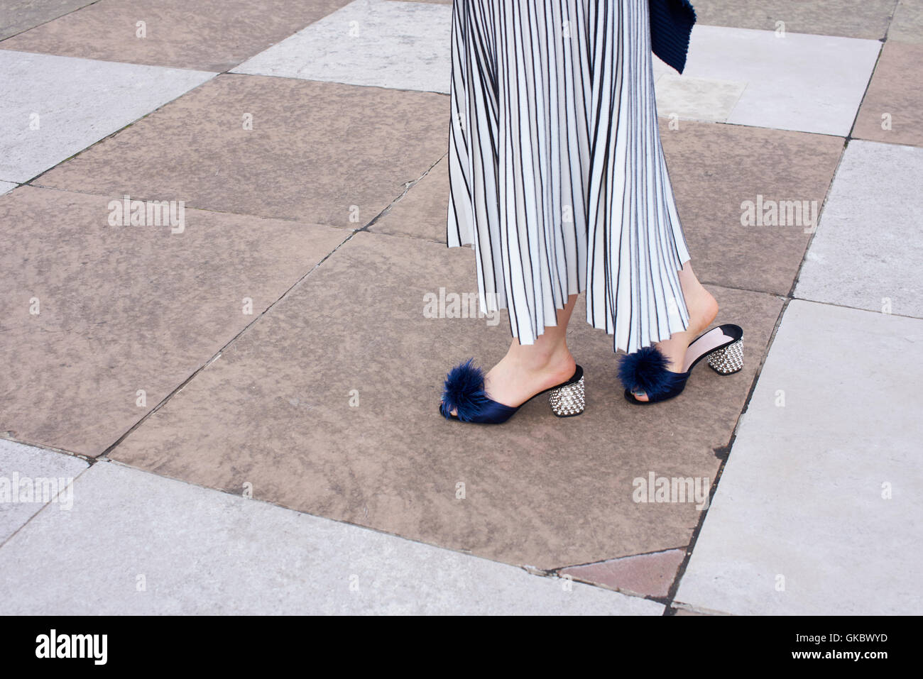 Woman in long skirt and mules walking 