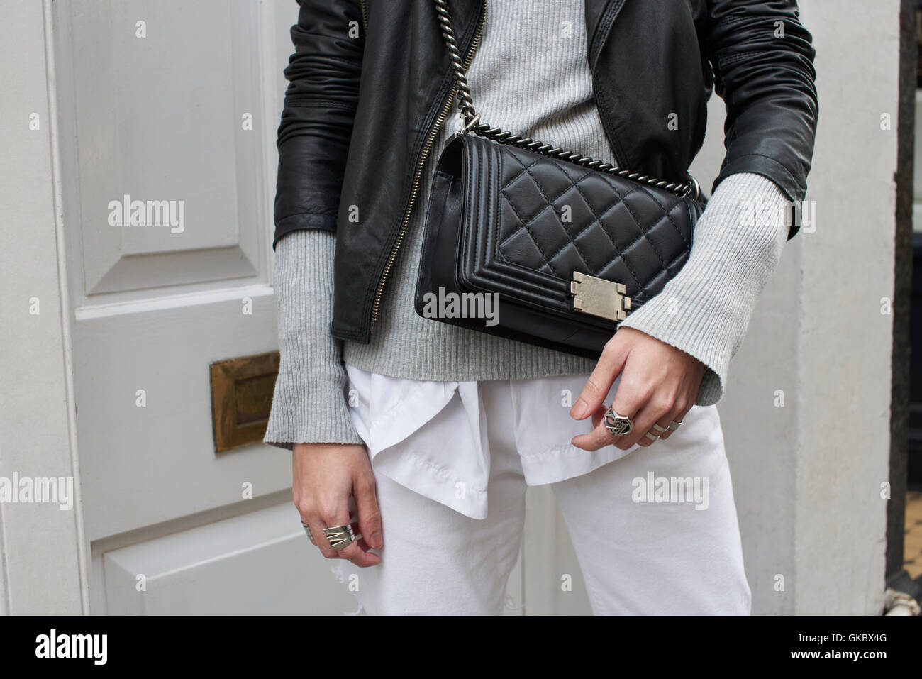 Mid section of fashionable man with a designer handbag Stock Photo