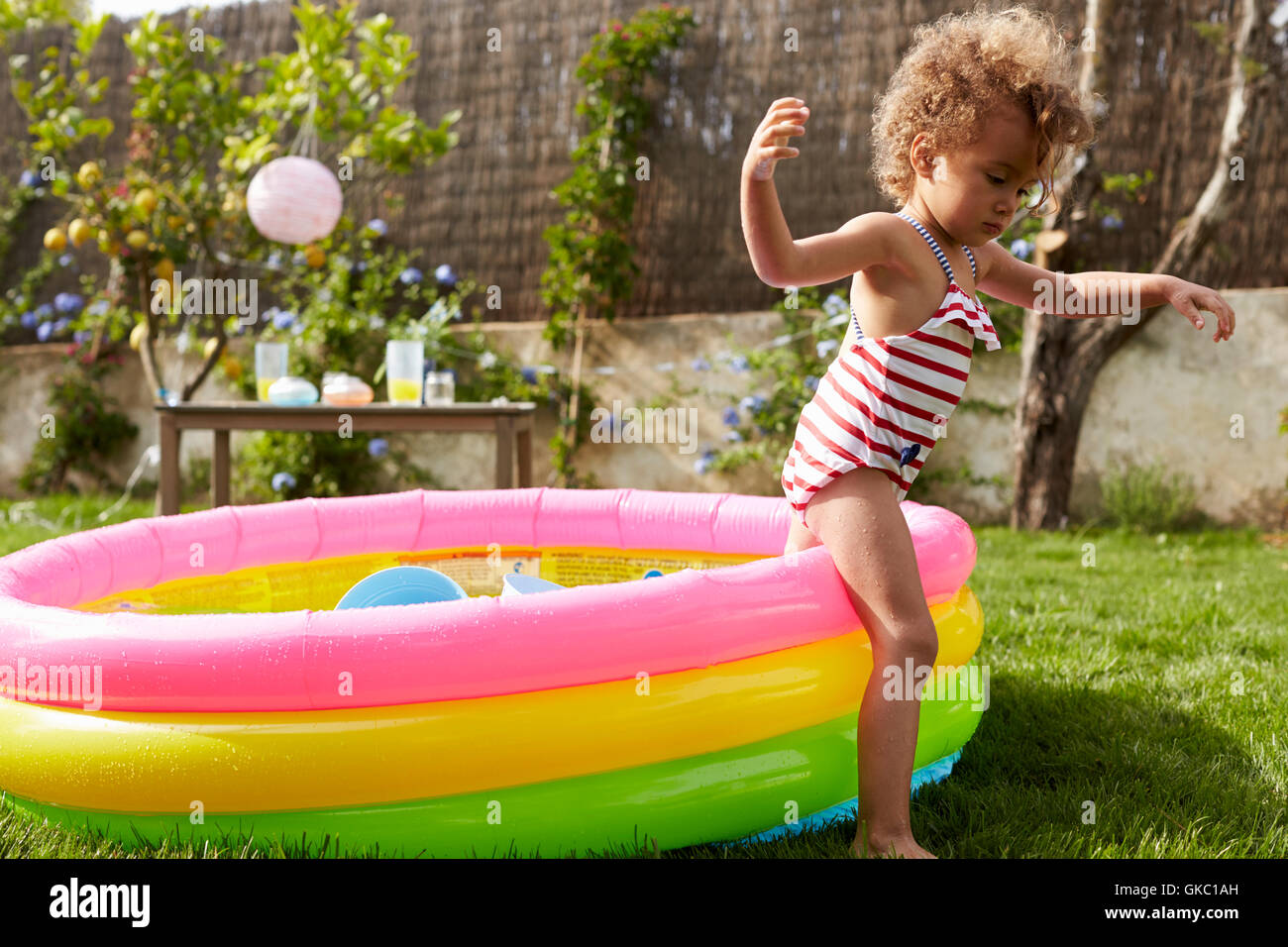 Girl Having Fun In Garden Paddling Pool Stock Photo Alamy
