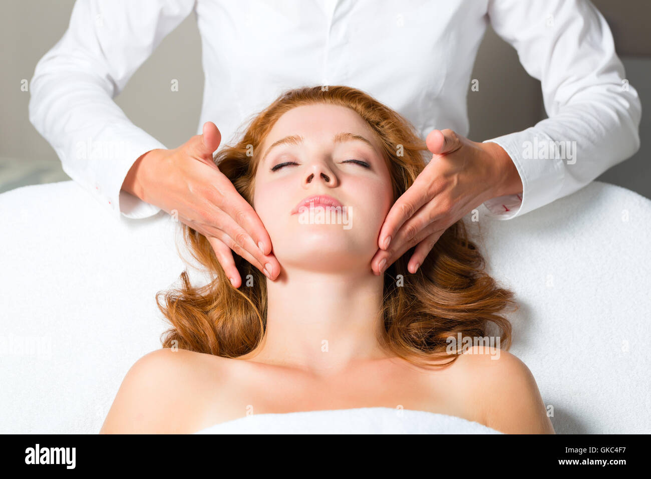 wellness woman receiving head massage in spa Stock Photo Alamy