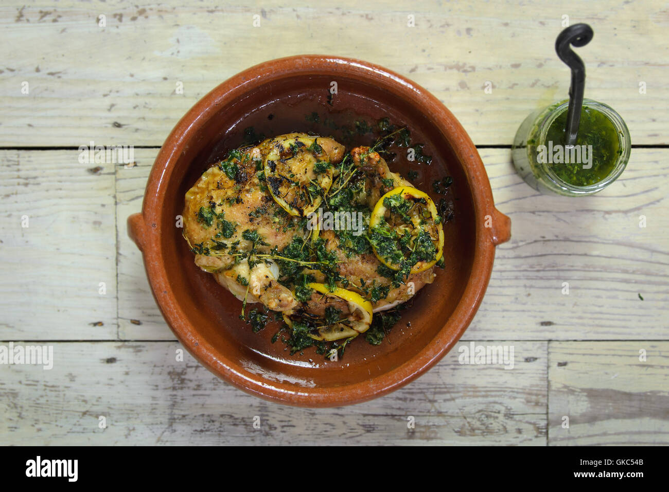 Roasted chicken with salsa and herbs Stock Photo