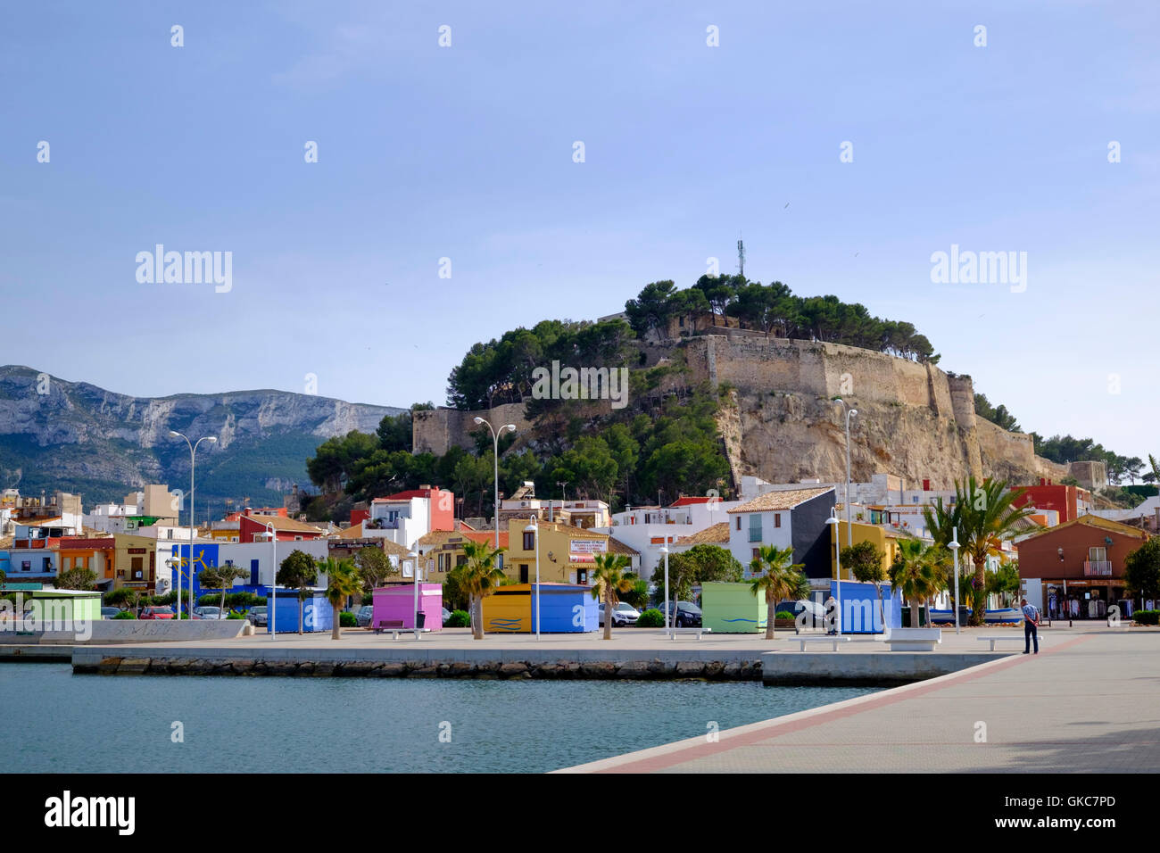 Colourful kiosks on the marina side under Denia Castle Stock Photo