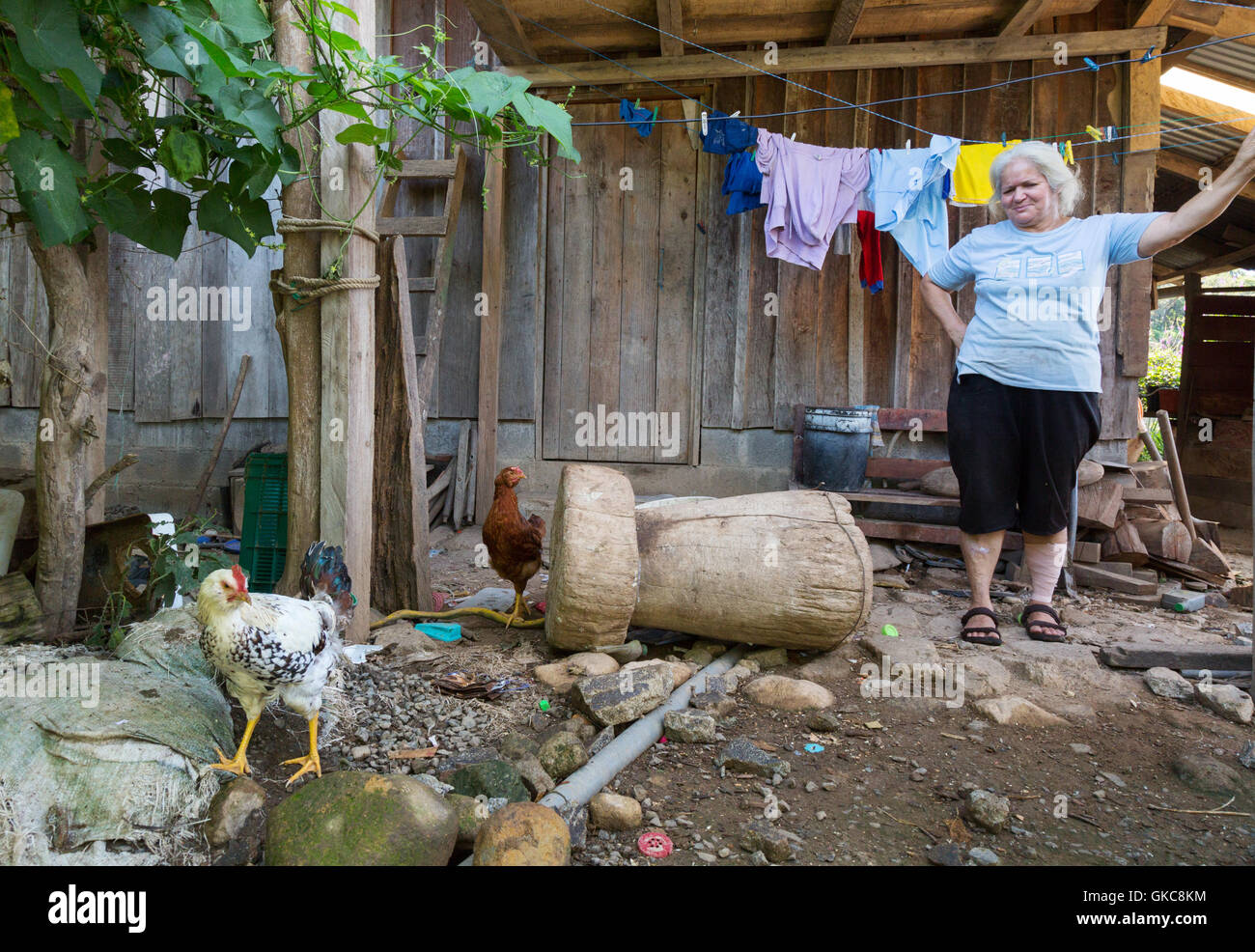 Local Costa Rican women in her yard, Monteverde, Costa Rica Latin America  ( Central America ) Stock Photo
