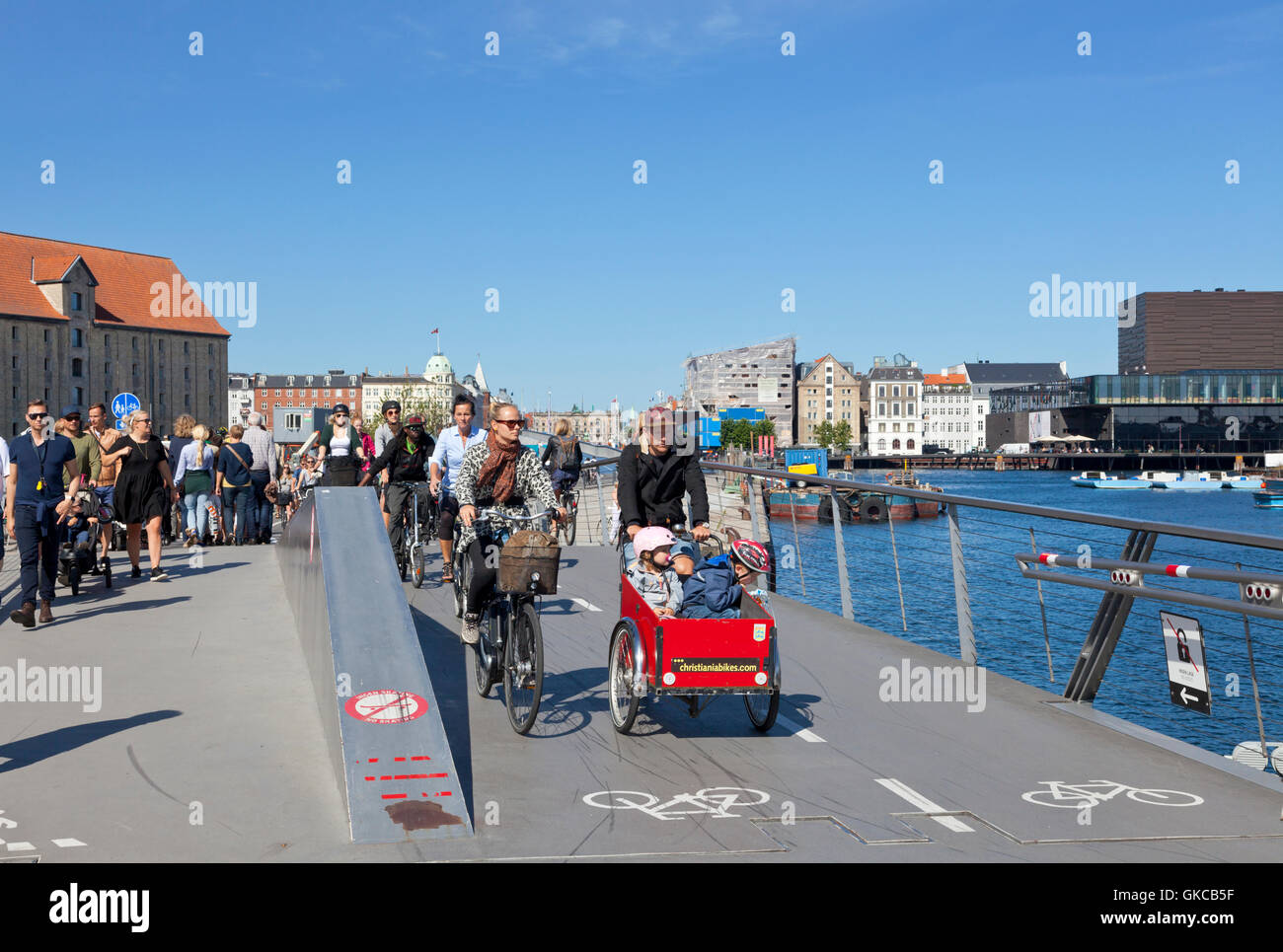 Cyclists and pedestrians on the Trangrav Bridge, Trangravsbroen. Copenhagen, Denmark. Part of the Harbour Circle. Cyclers cycler. Bridges. Stock Photo