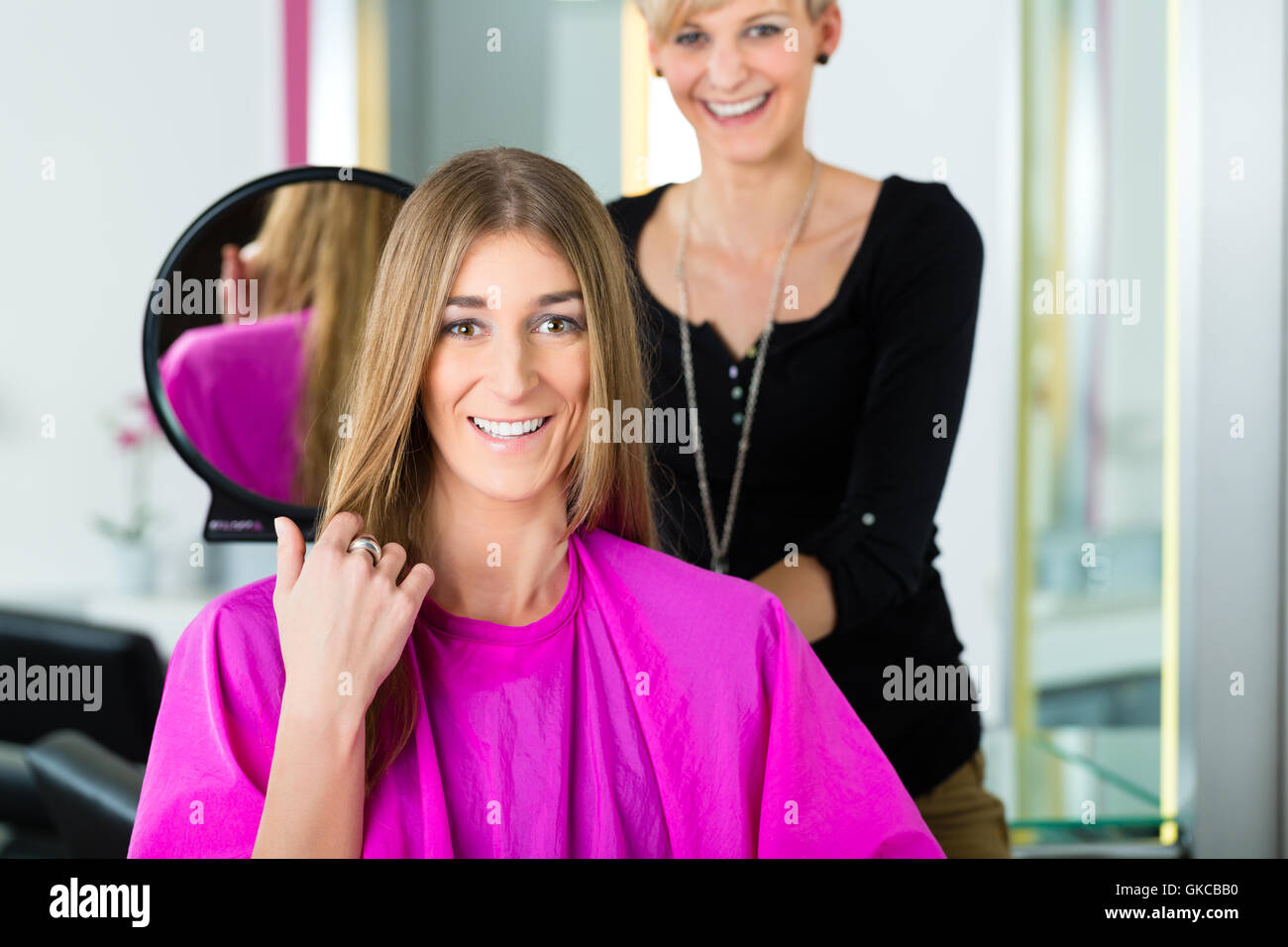 woman at the hairdresser with advice Stock Photo Alamy