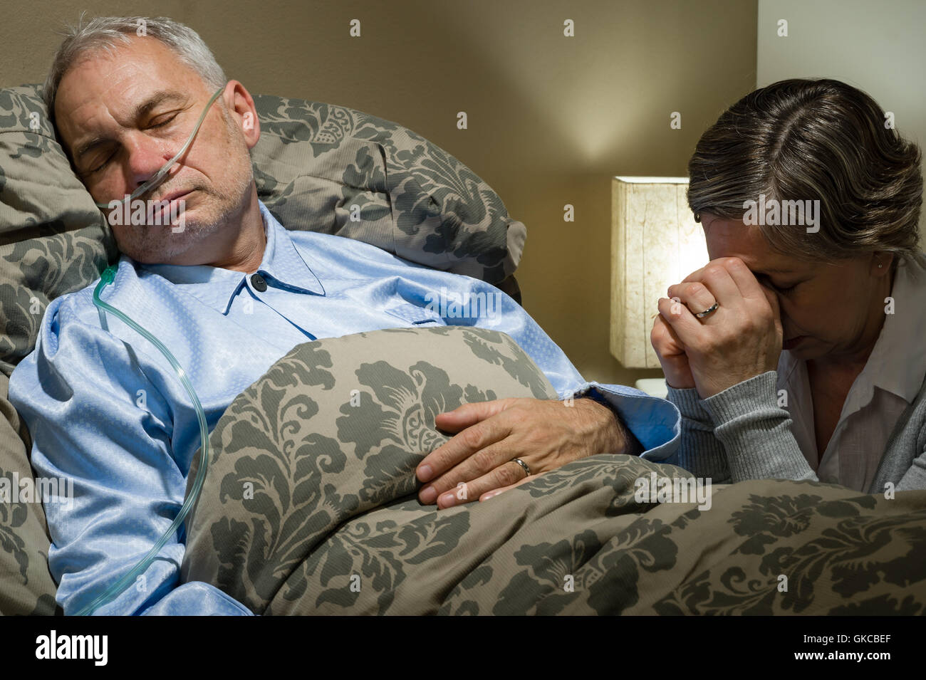 Older woman crying bed hi-res stock photography and images - Alamy