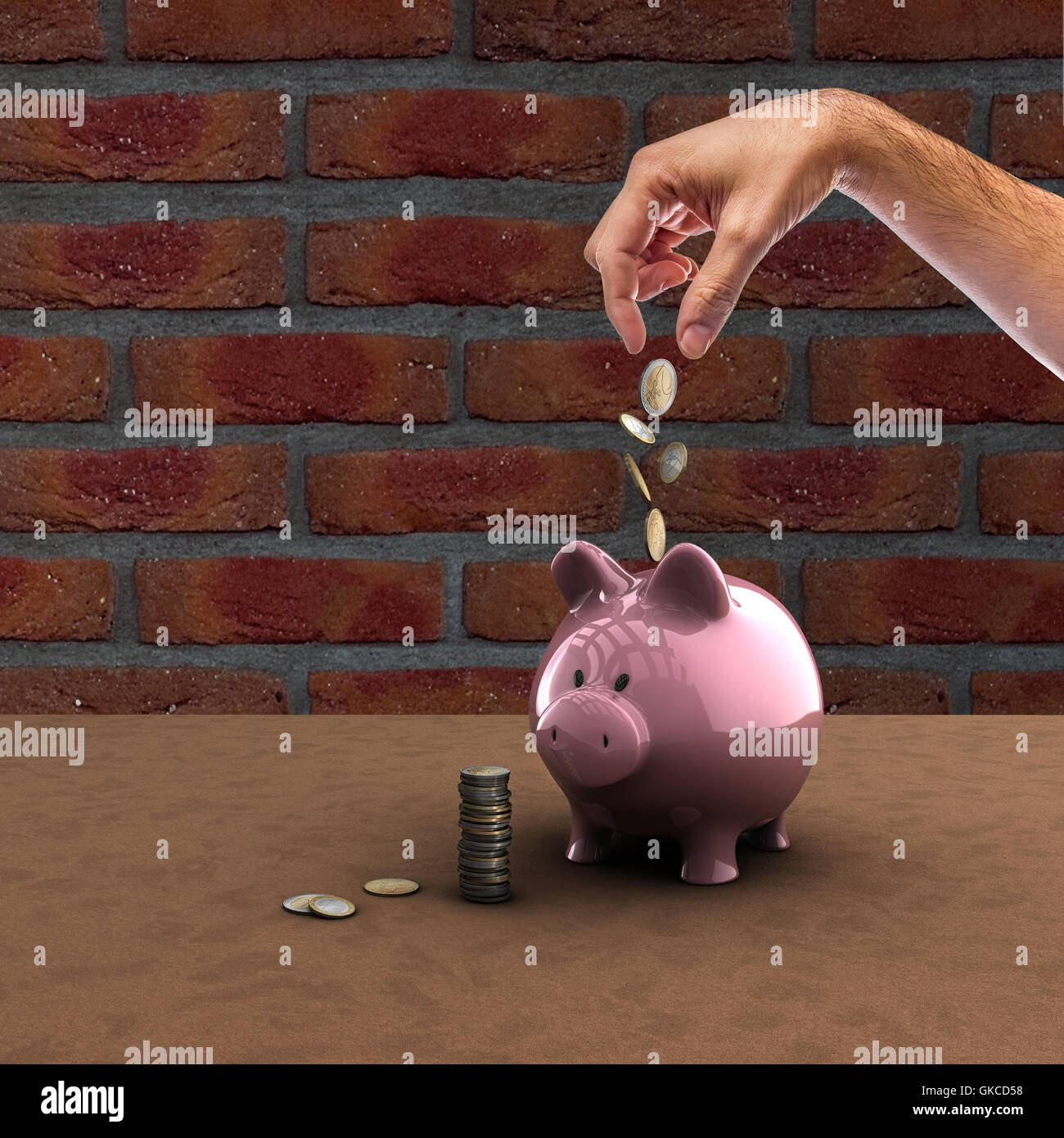 Person hand dropping gold coins into a piggy bank hi-res stock ...