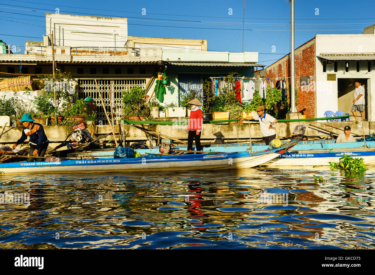 Soc Trang, Vietnam - Nov 22, 2014: Local people on boat at Nga Nam floating market in early morning. Stock Photo