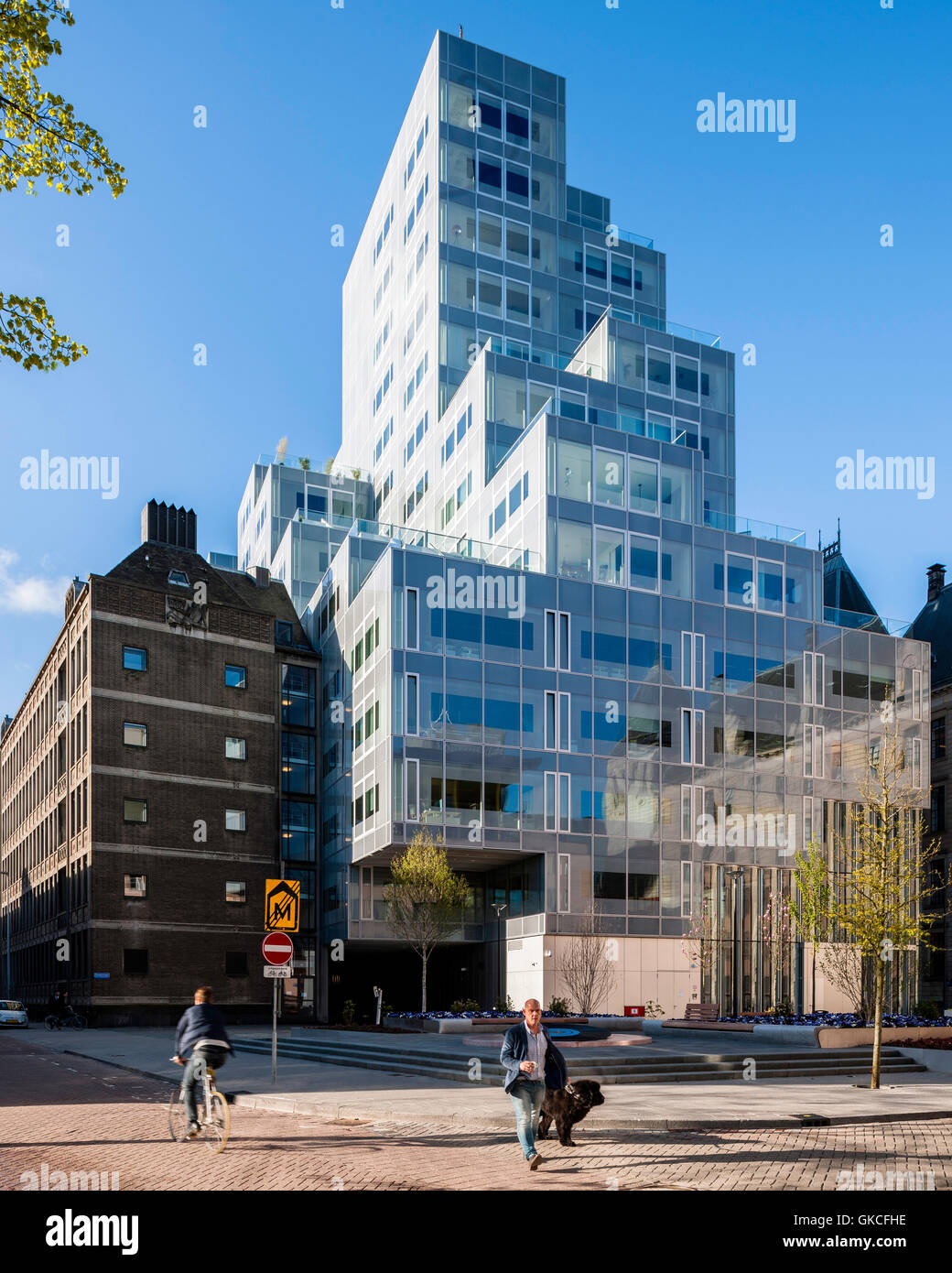 Exterior morning view of rear of building  reflecting old City Council Exterior morning view of rear of building. Timmerhuis, Rotterdam, Netherlands. Architect: OMA Rem Koolhaas, 2015. Stock Photo