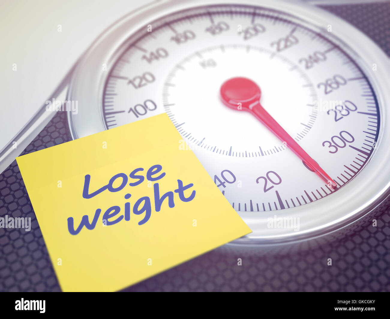 Weight scale with reminder to lose weight. Depth of field with focus on the reminder. Stock Photo