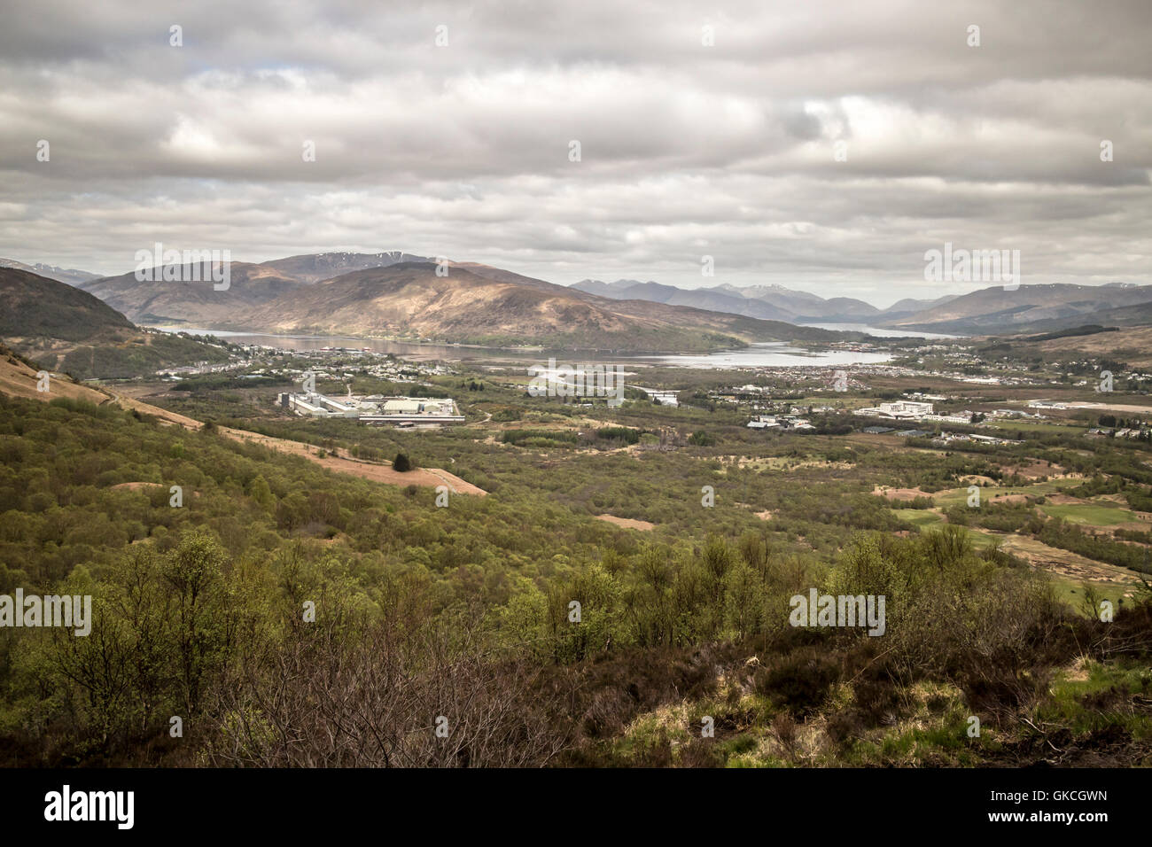 Looking down onto Fort William from the approach to the north face of Ben Nevis Stock Photo